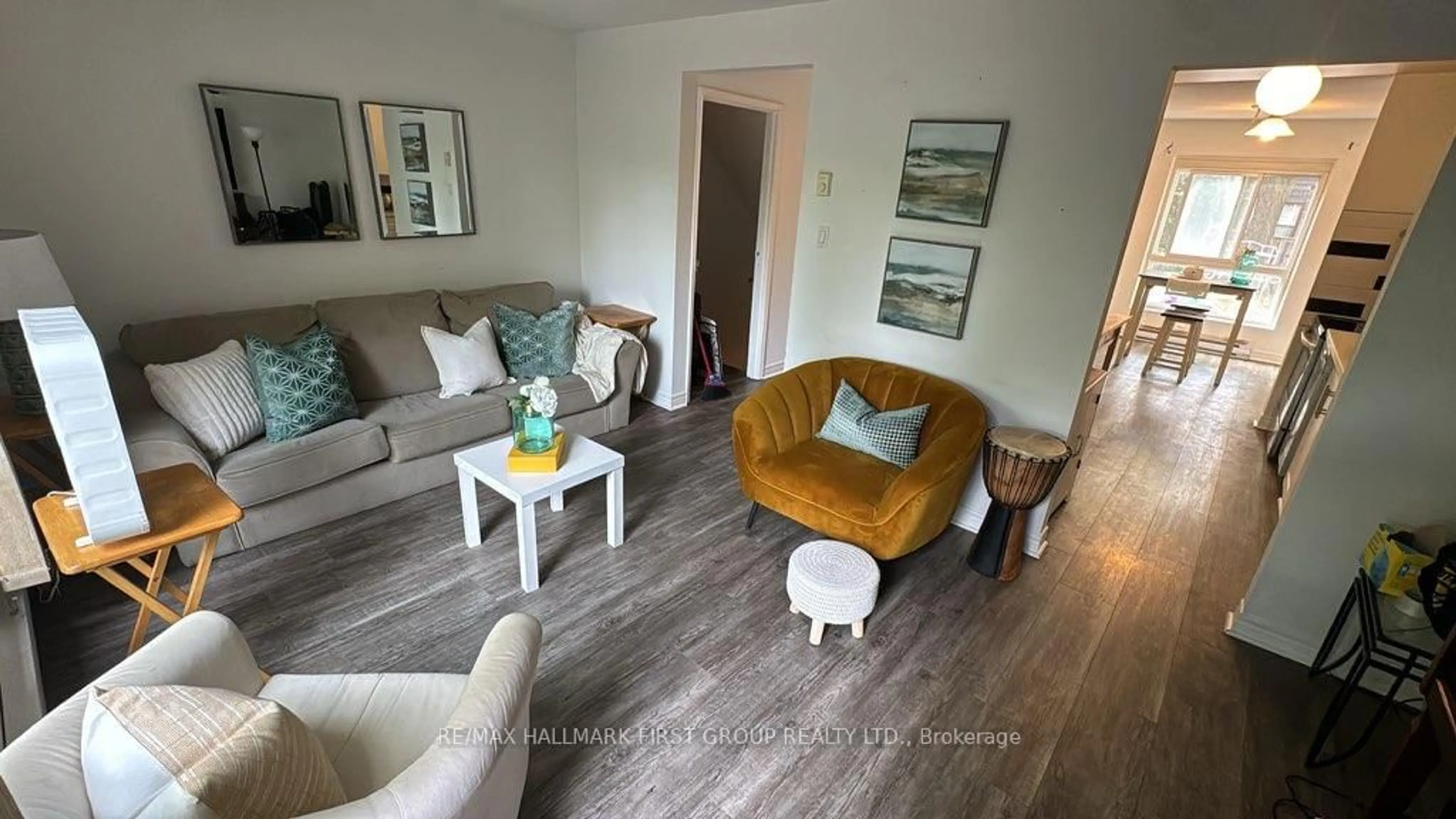 Living room with furniture, wood/laminate floor for 6 Rock Fern Way #258, Toronto Ontario M2J 4N2