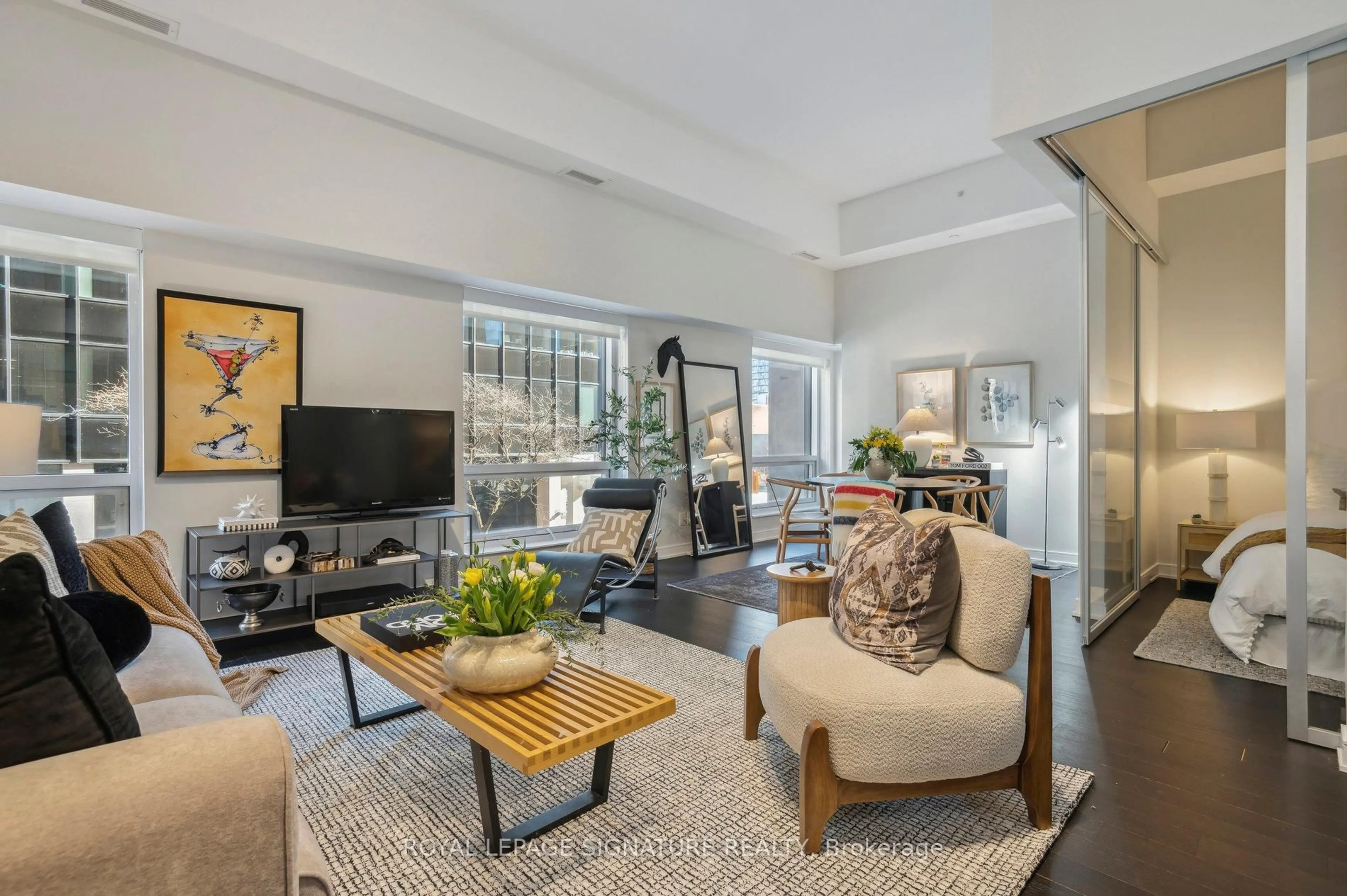 Living room with furniture, unknown for 88 Scott St #210, Toronto Ontario M5E 0A9