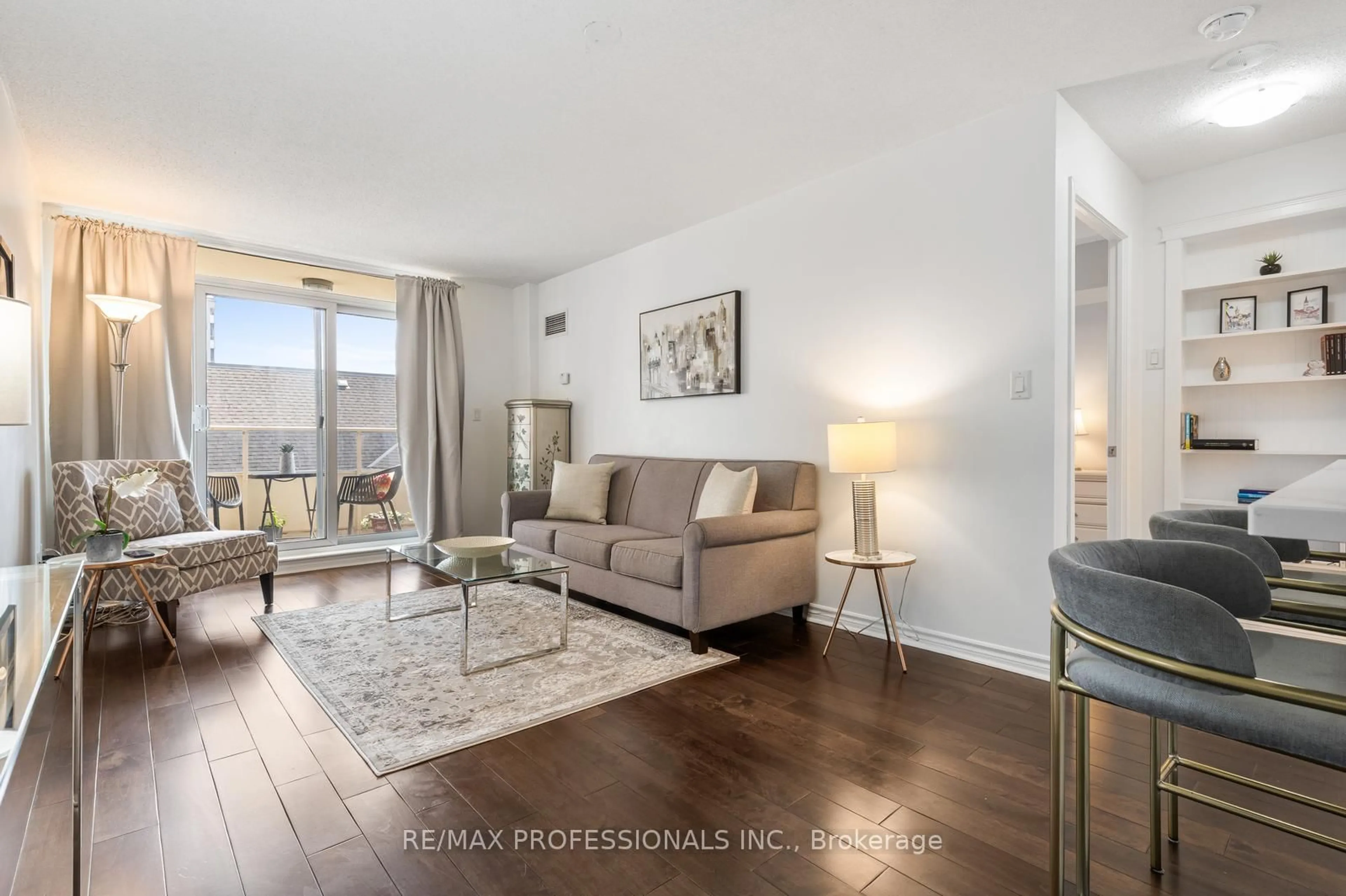 Living room with furniture, wood/laminate floor for 8 Rean Dr #411, Toronto Ontario M2K 3B9