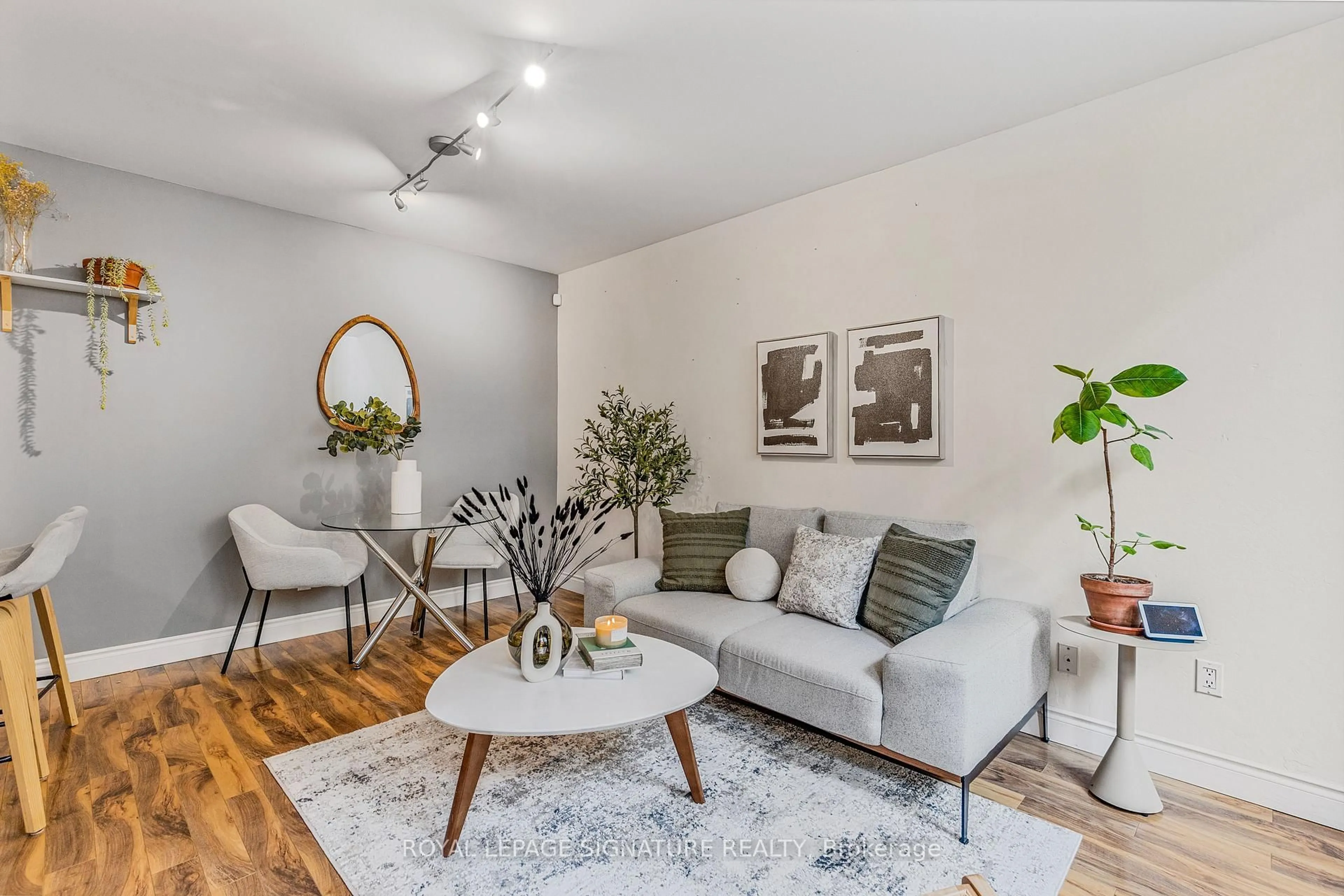Living room with furniture, wood/laminate floor for 46 Western Battery Rd #812, Toronto Ontario M6K 3P1