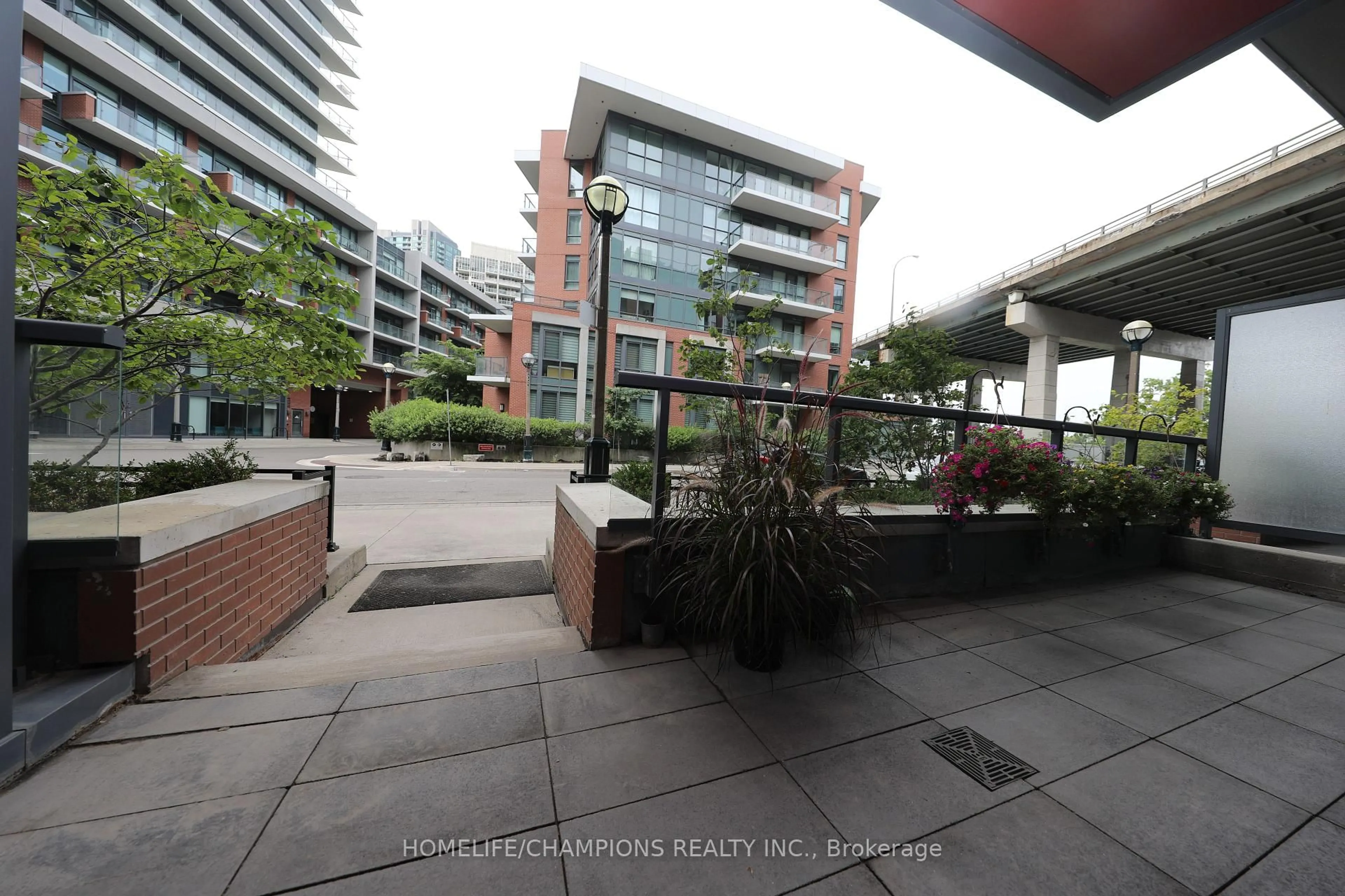 Patio, city buildings view from balcony for 20 Bruyeres Mews #Th10, Toronto Ontario M5V 0G8