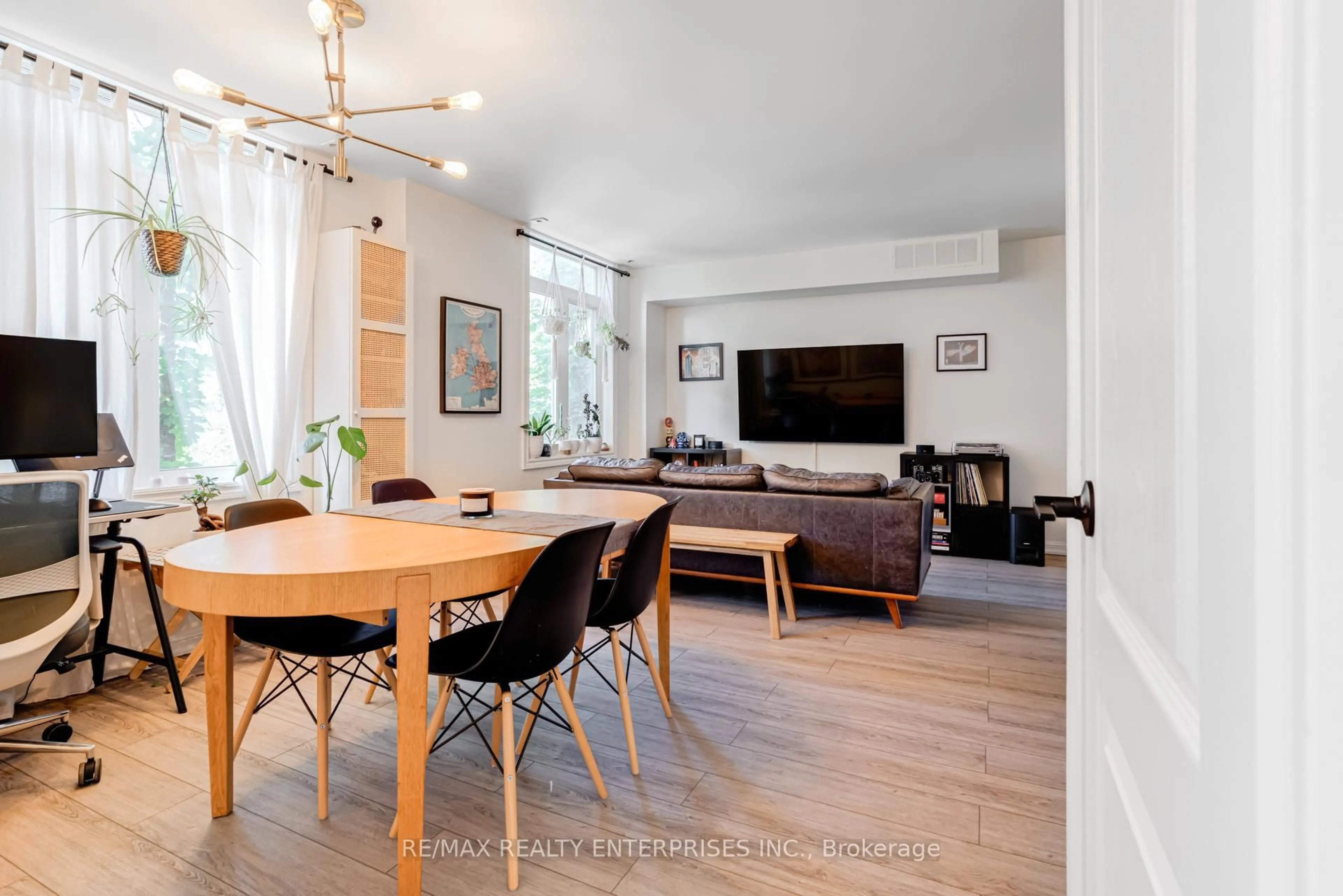 Living room with furniture, wood/laminate floor for 41 Sudbury St #4106, Toronto Ontario M6J 3W6