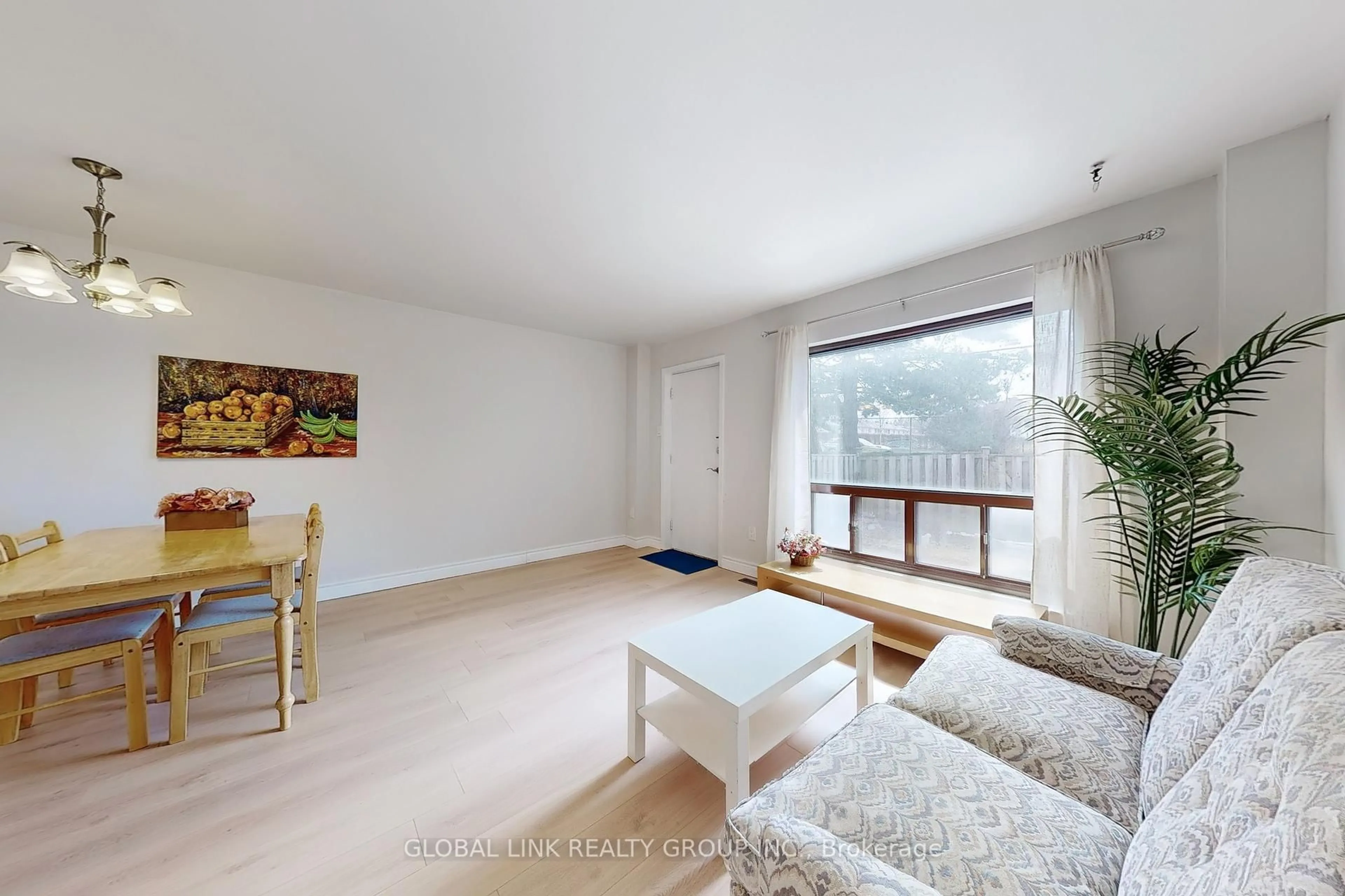 Living room with furniture, wood/laminate floor for 85 Rameau Dr #6, Toronto Ontario M2H 1T6