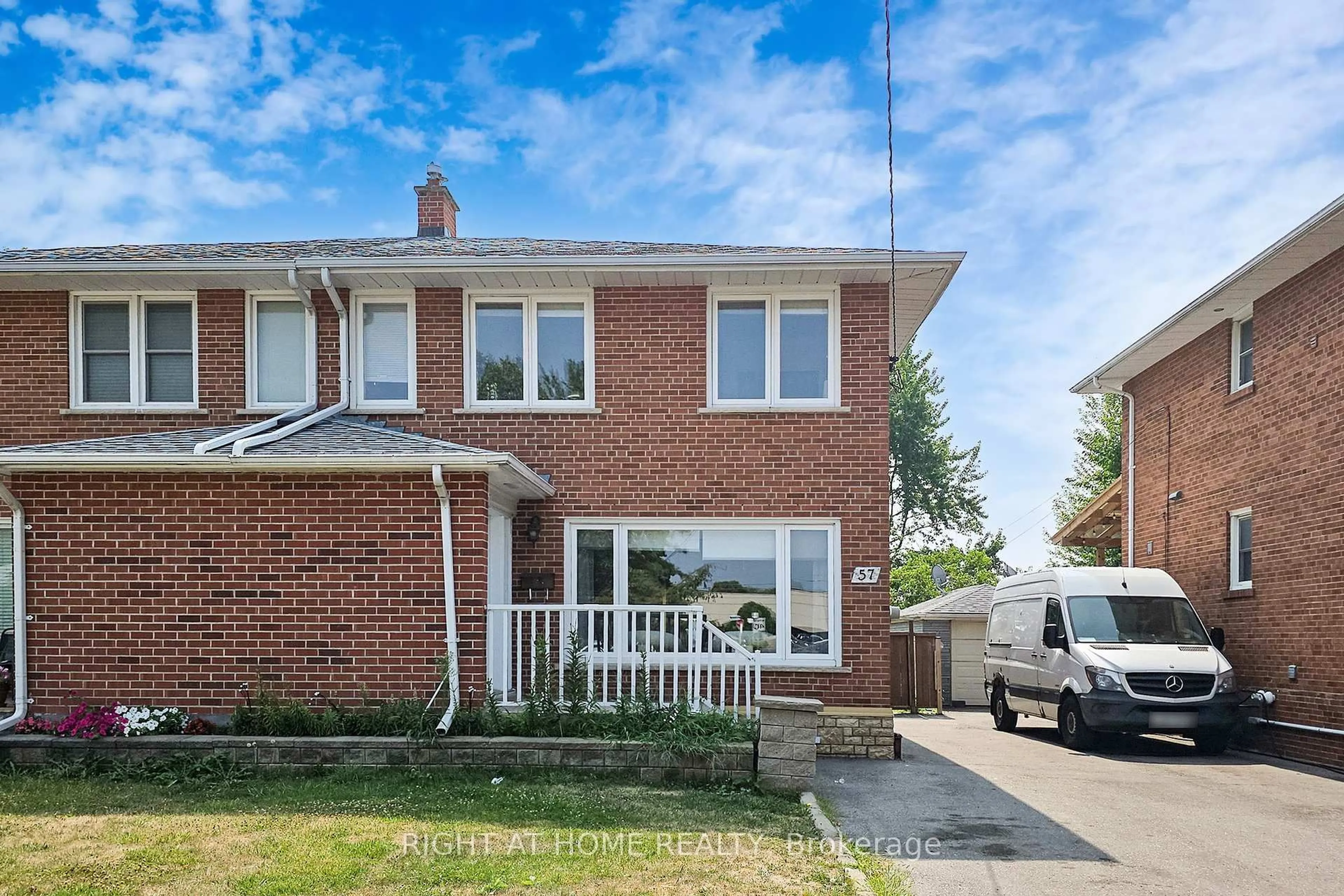 Home with brick exterior material, street for 57 Wyndcliff Cres, Toronto Ontario M4A 2J9