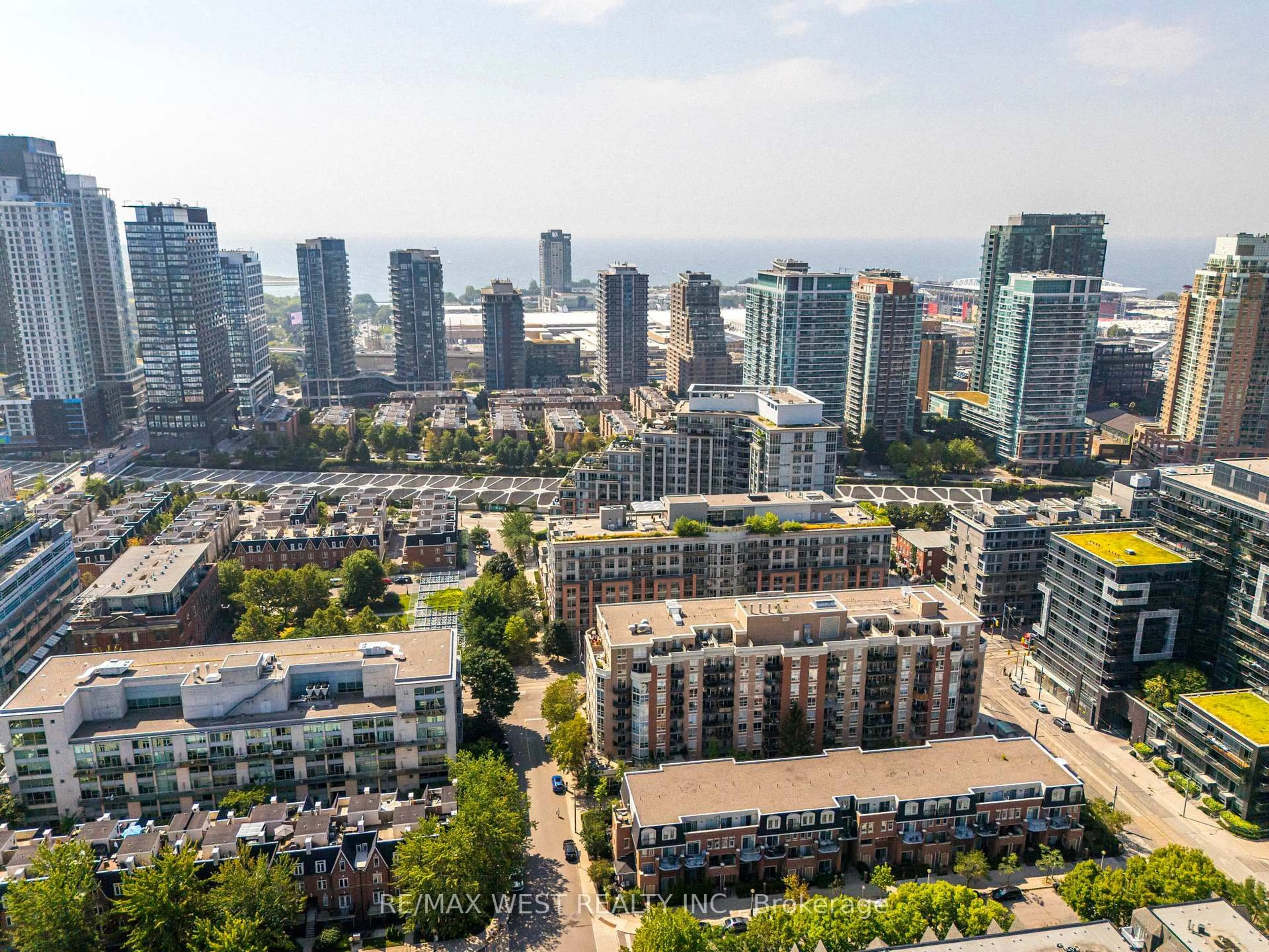 A pic from outside/outdoor area/front of a property/back of a property/a pic from drone, city buildings view from balcony for 1000 King St #209, Toronto Ontario M6K 3N1