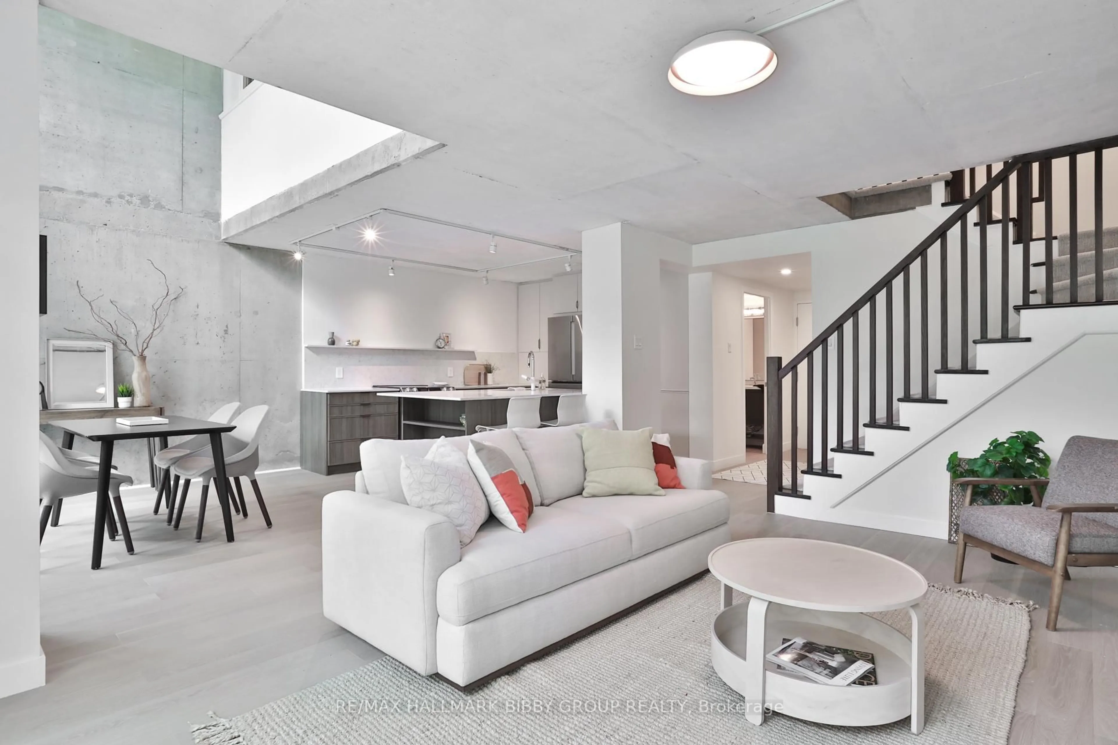 Living room with furniture, cement floor for 954 King St #330, Toronto Ontario M6K 3L9