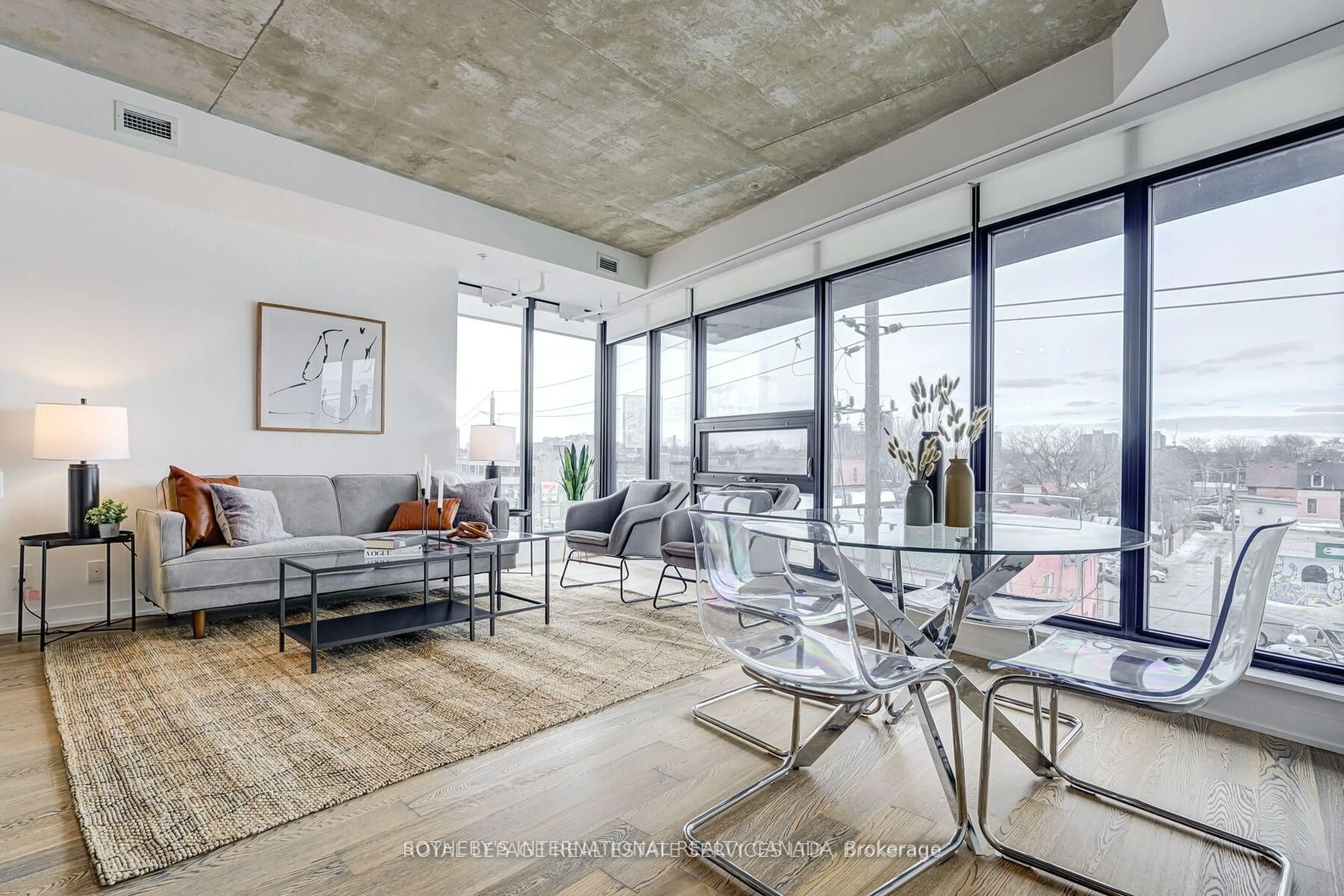 Living room with furniture, cement floor for 1239 Dundas St #404, Toronto Ontario M6J 0E8