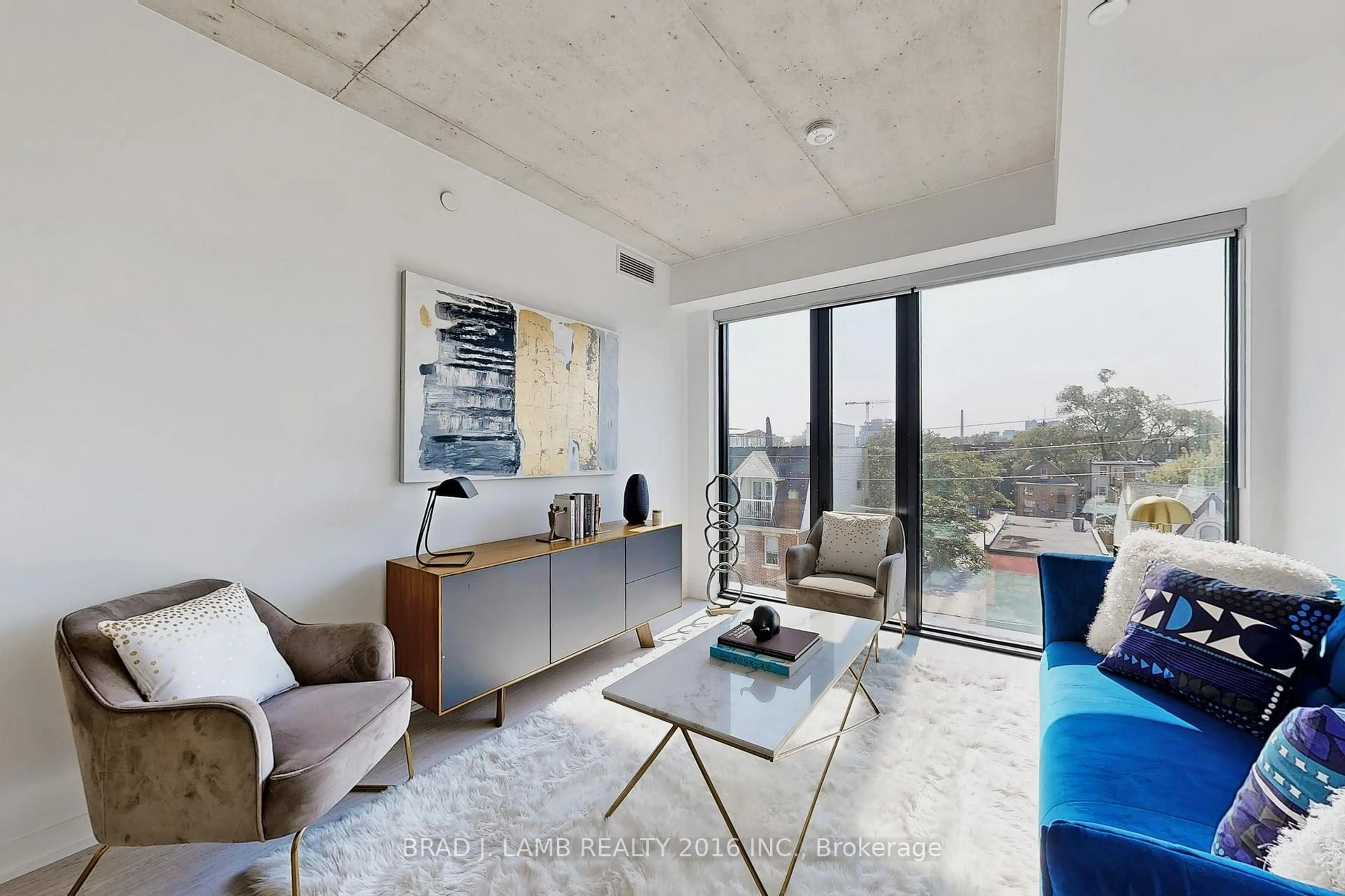 Living room with furniture, cement floor for 195 McCaul St #302, Toronto Ontario M5T 0E5
