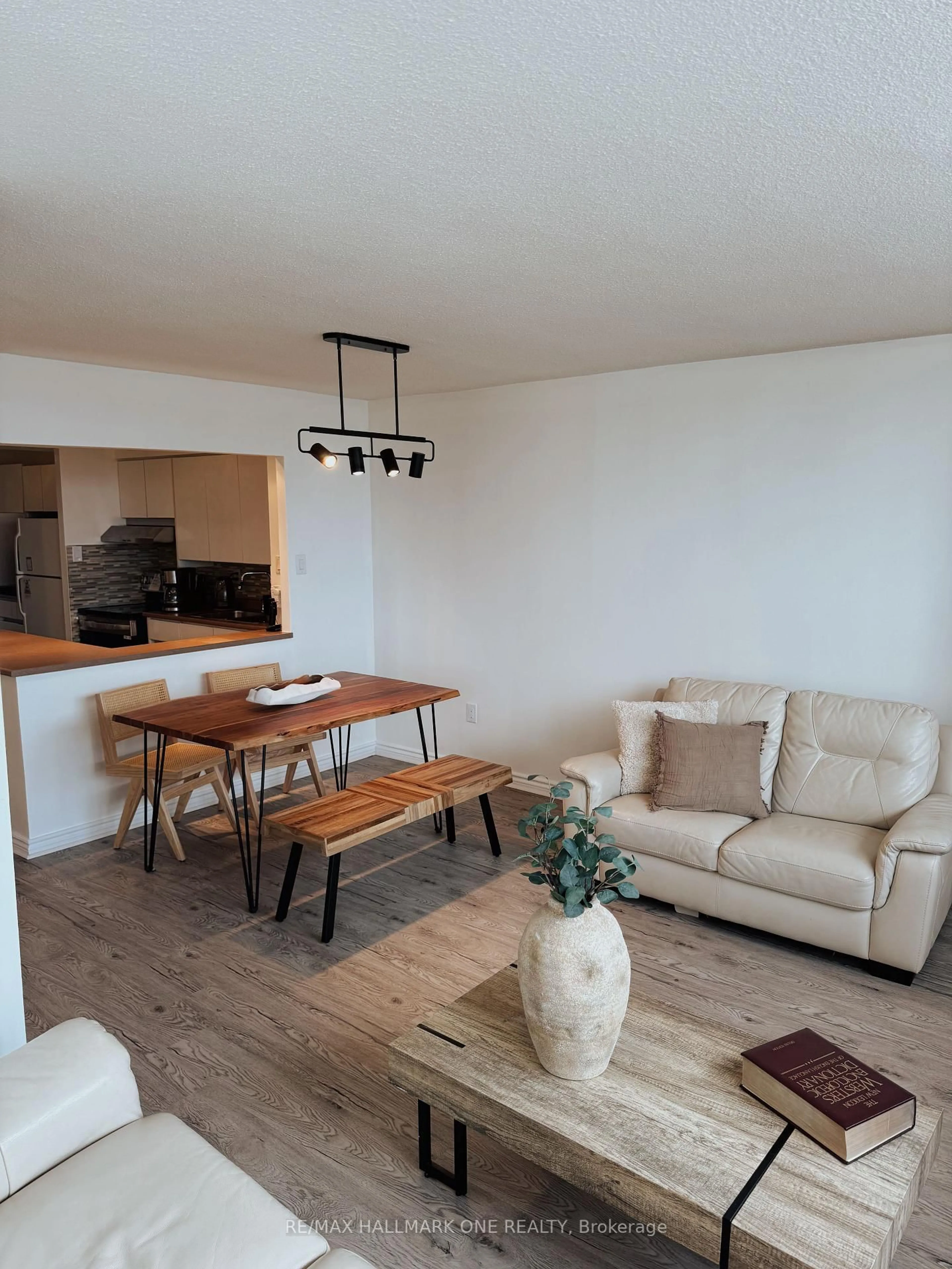 Living room with furniture, wood/laminate floor for 45 Sunrise Ave #904, Toronto Ontario M4A 2S3