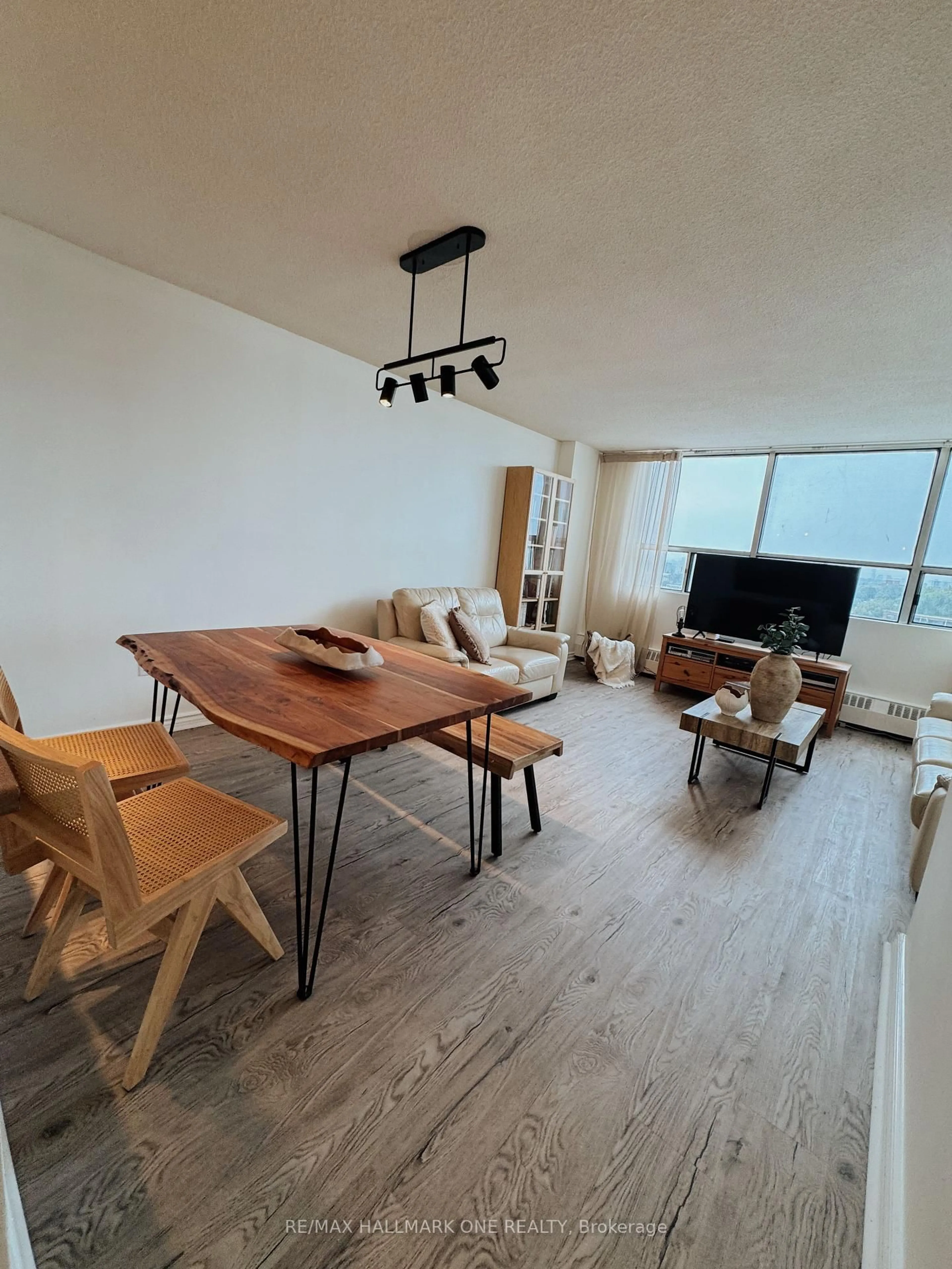 Living room with furniture, wood/laminate floor for 45 Sunrise Ave #904, Toronto Ontario M4A 2S3