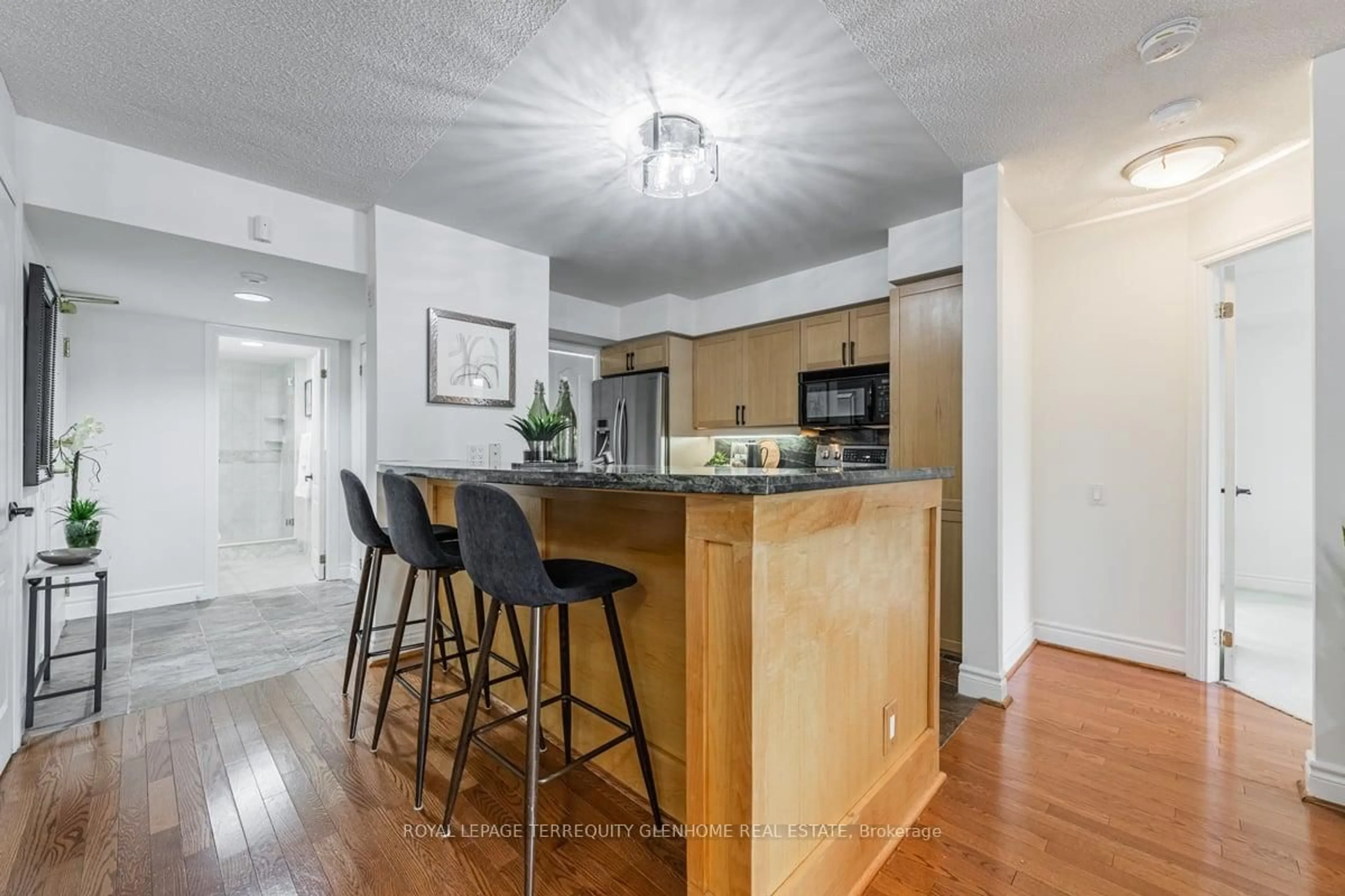 Open concept kitchen, wood/laminate floor for 2 Alexandra Blvd #207, Toronto Ontario M4R 1L7