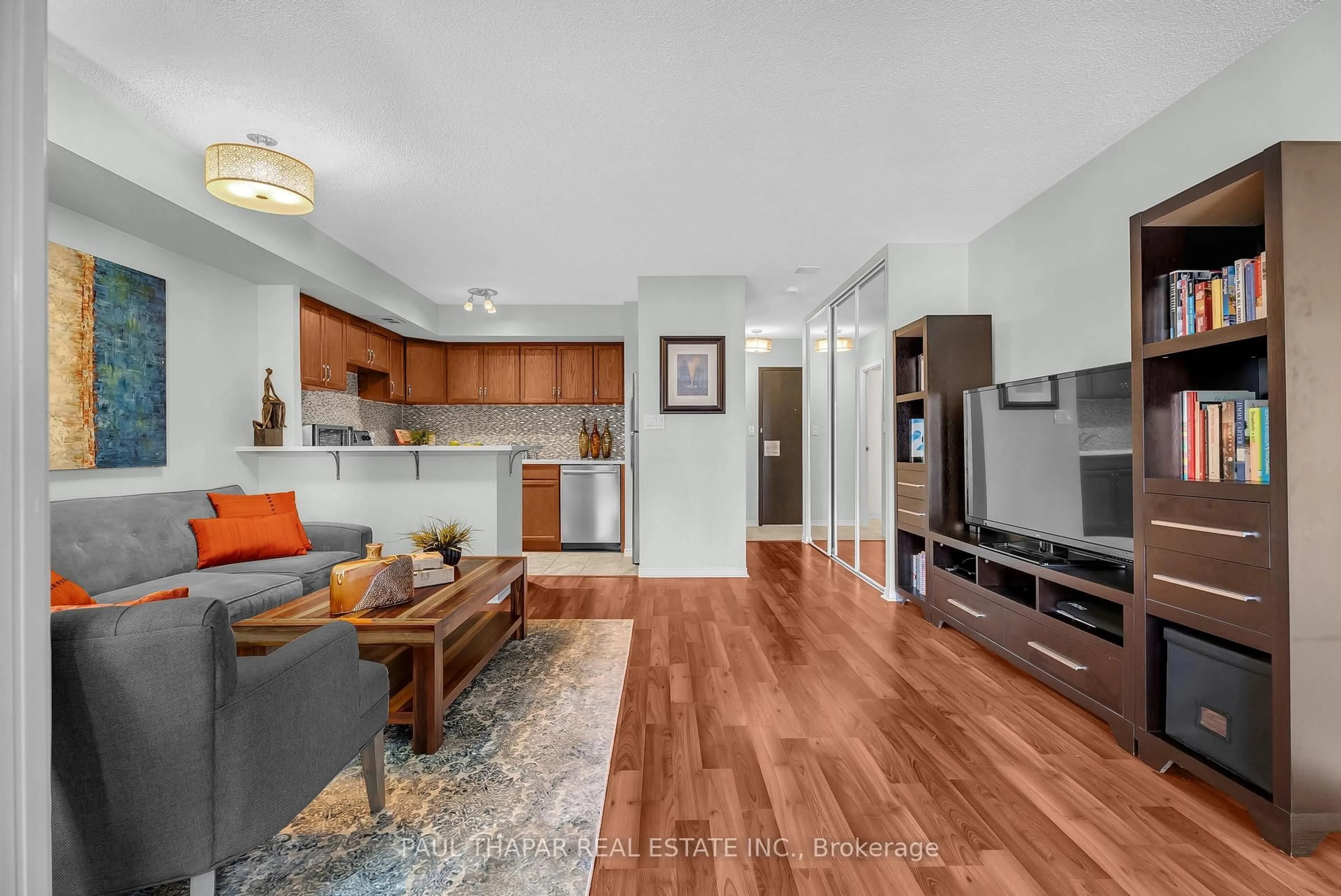 Living room with furniture, wood/laminate floor for 18 Yonge St #2411, Toronto Ontario M5E 1Z8