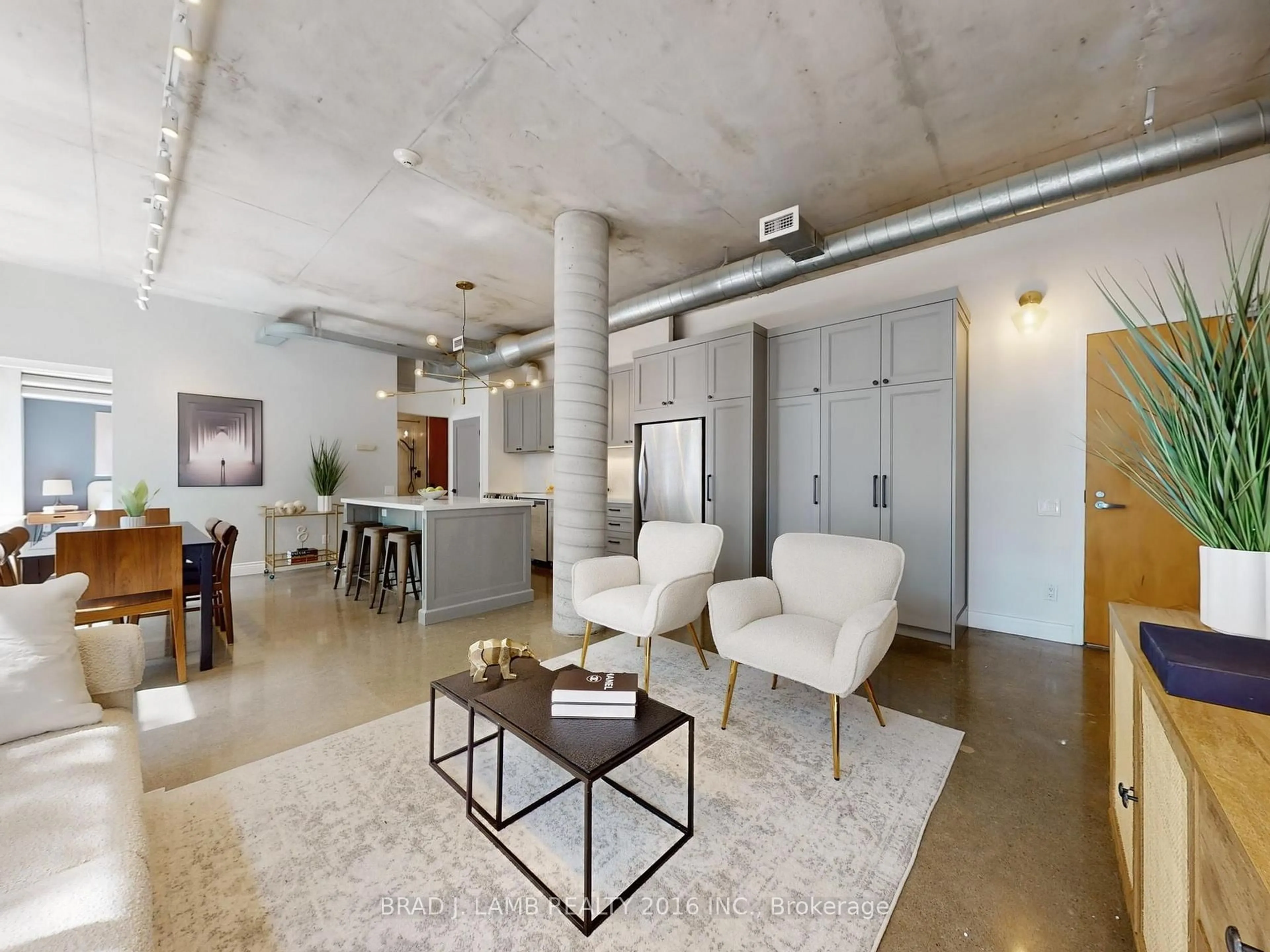 Living room with furniture, cement floor for 29 Camden St #305, Toronto Ontario M5V 3N3