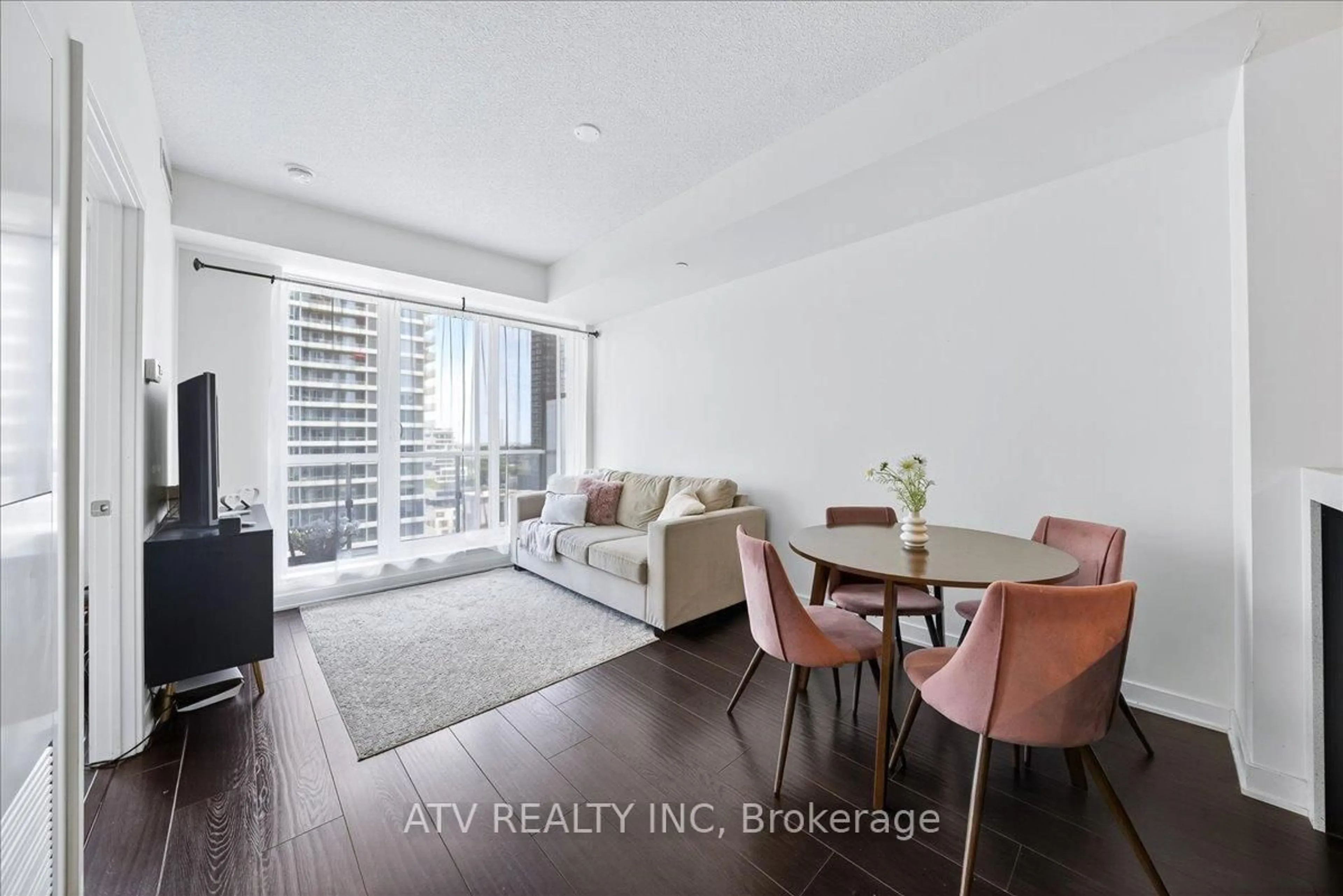 Living room with furniture, wood/laminate floor for 170 Sumach St #1113, Toronto Ontario M5A 3H7