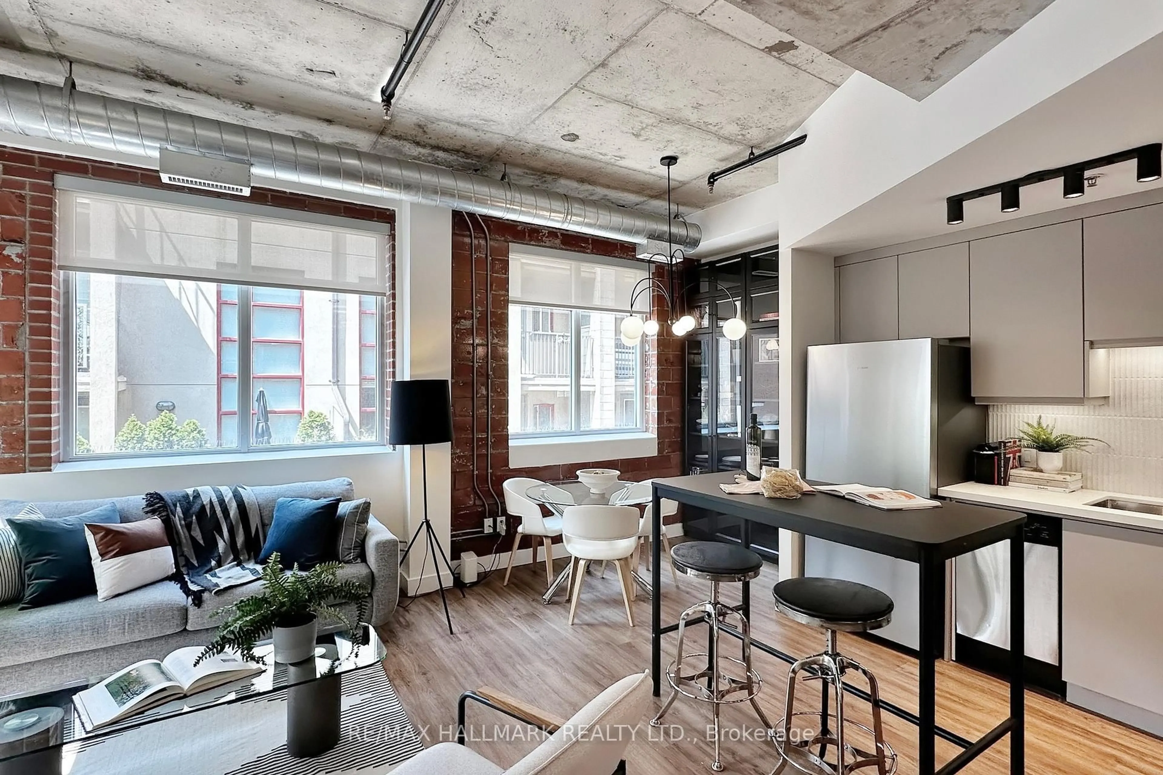 Open concept kitchen, cement floor for 10 Wellesley Pl #206, Toronto Ontario M4Y 1B1