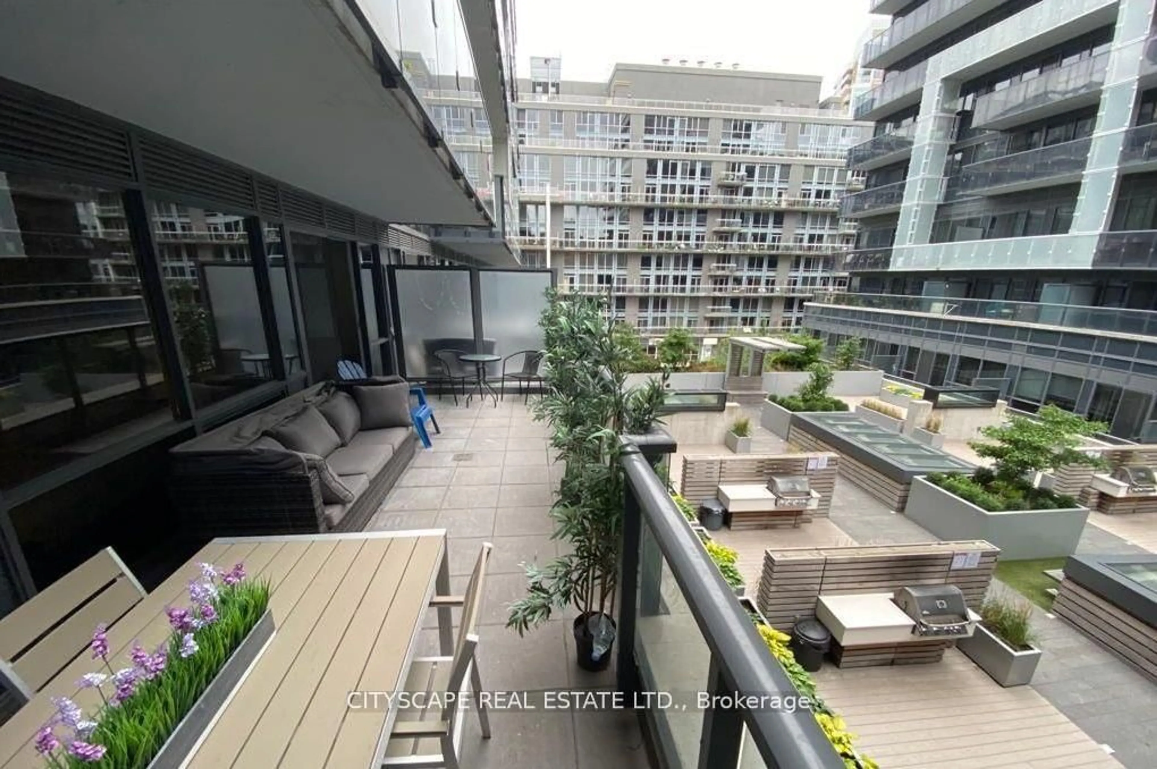 Patio, city buildings view from balcony for 1030 King St #332, Toronto Ontario M6K 0B4