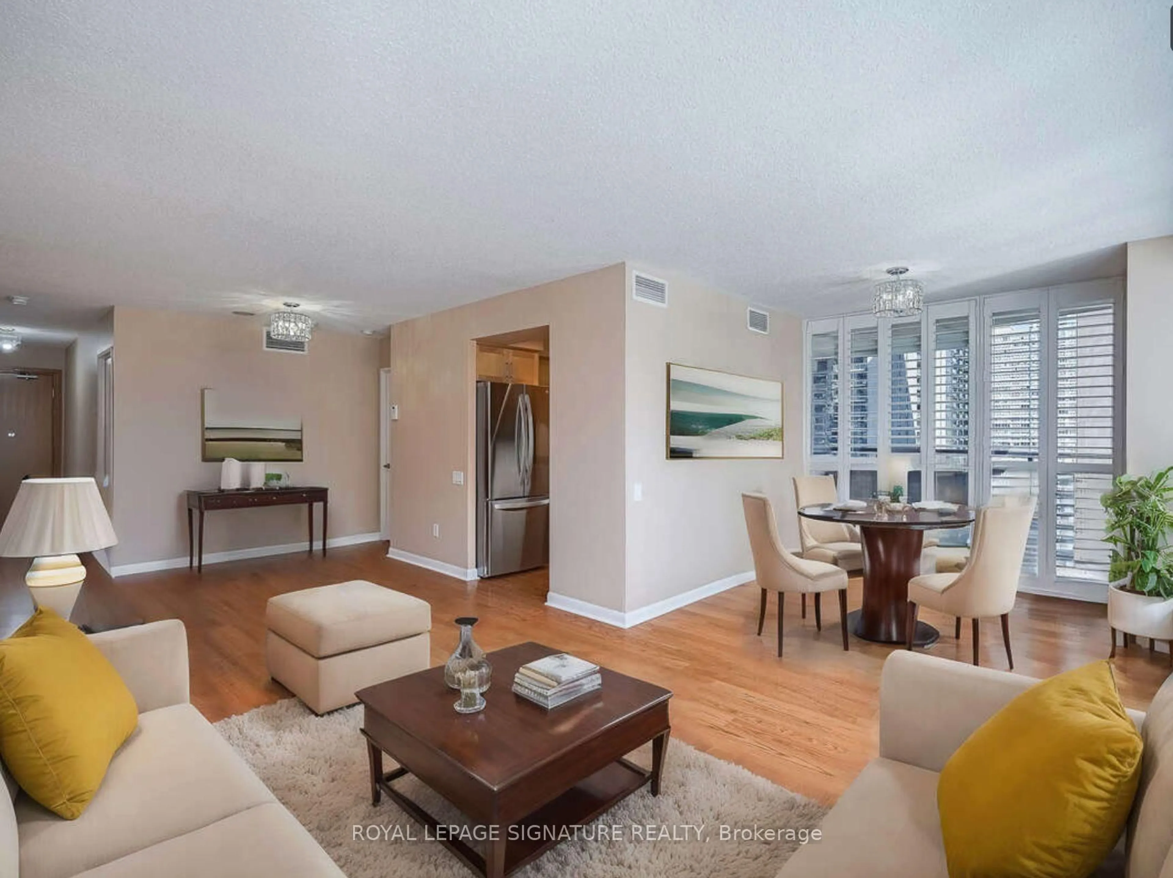 Living room with furniture, wood/laminate floor for 33 Sheppard Ave #910, Toronto Ontario M2N 7K1