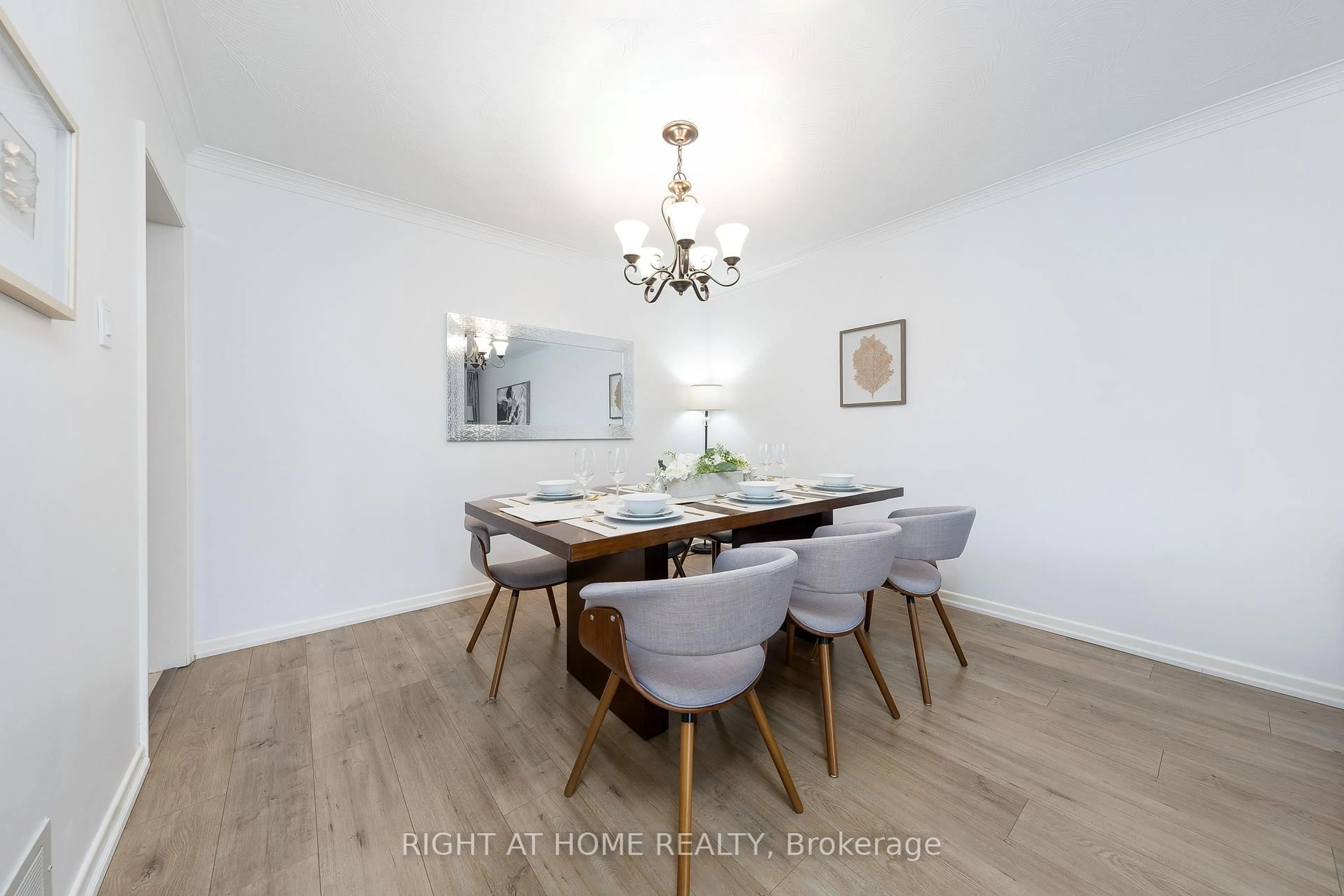 Dining room, wood/laminate floor for 71 pleasant view Dr, Toronto Ontario M2J 3R2