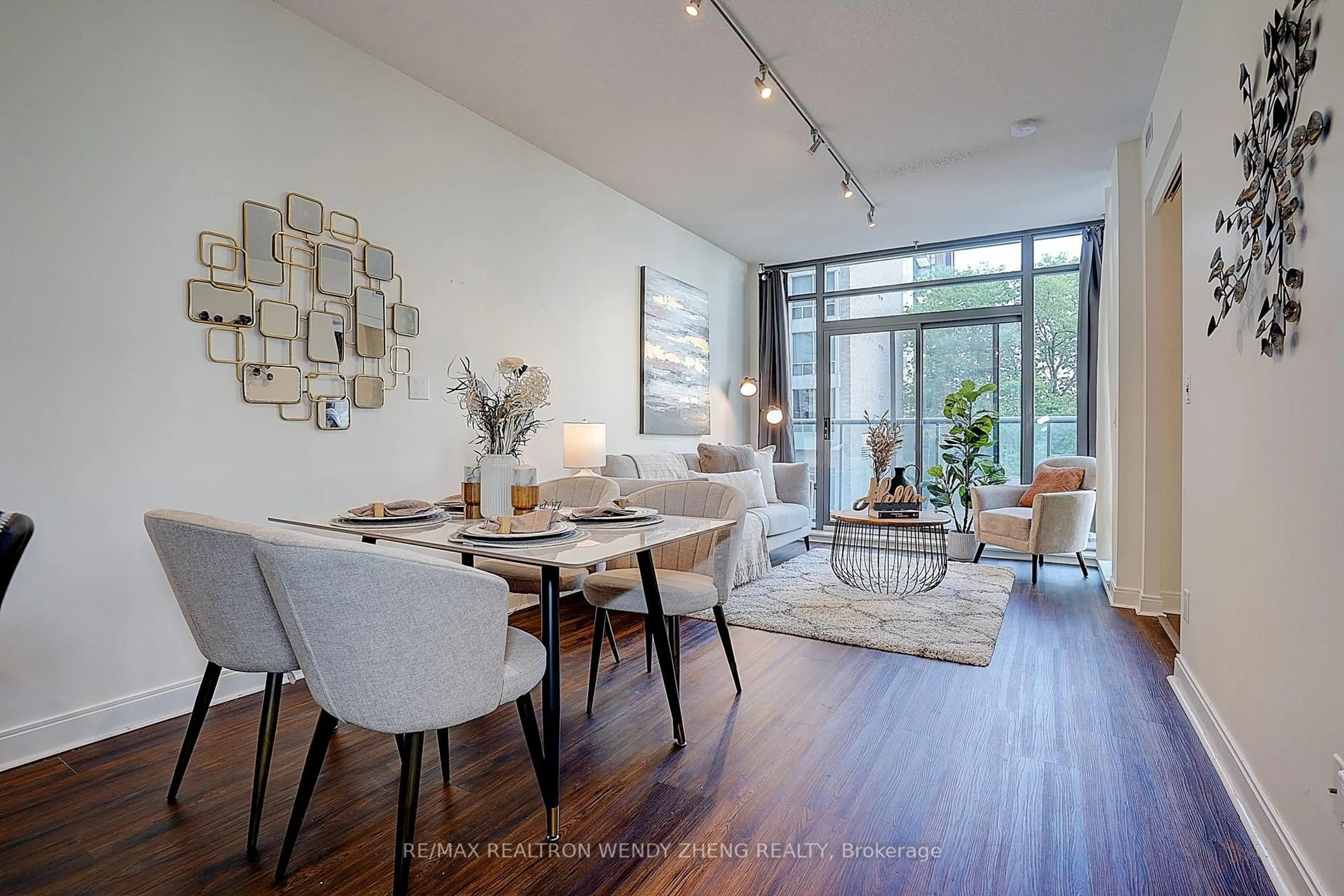 Living room with furniture, wood/laminate floor for 21 Scollard St #411, Toronto Ontario M5R 1G1