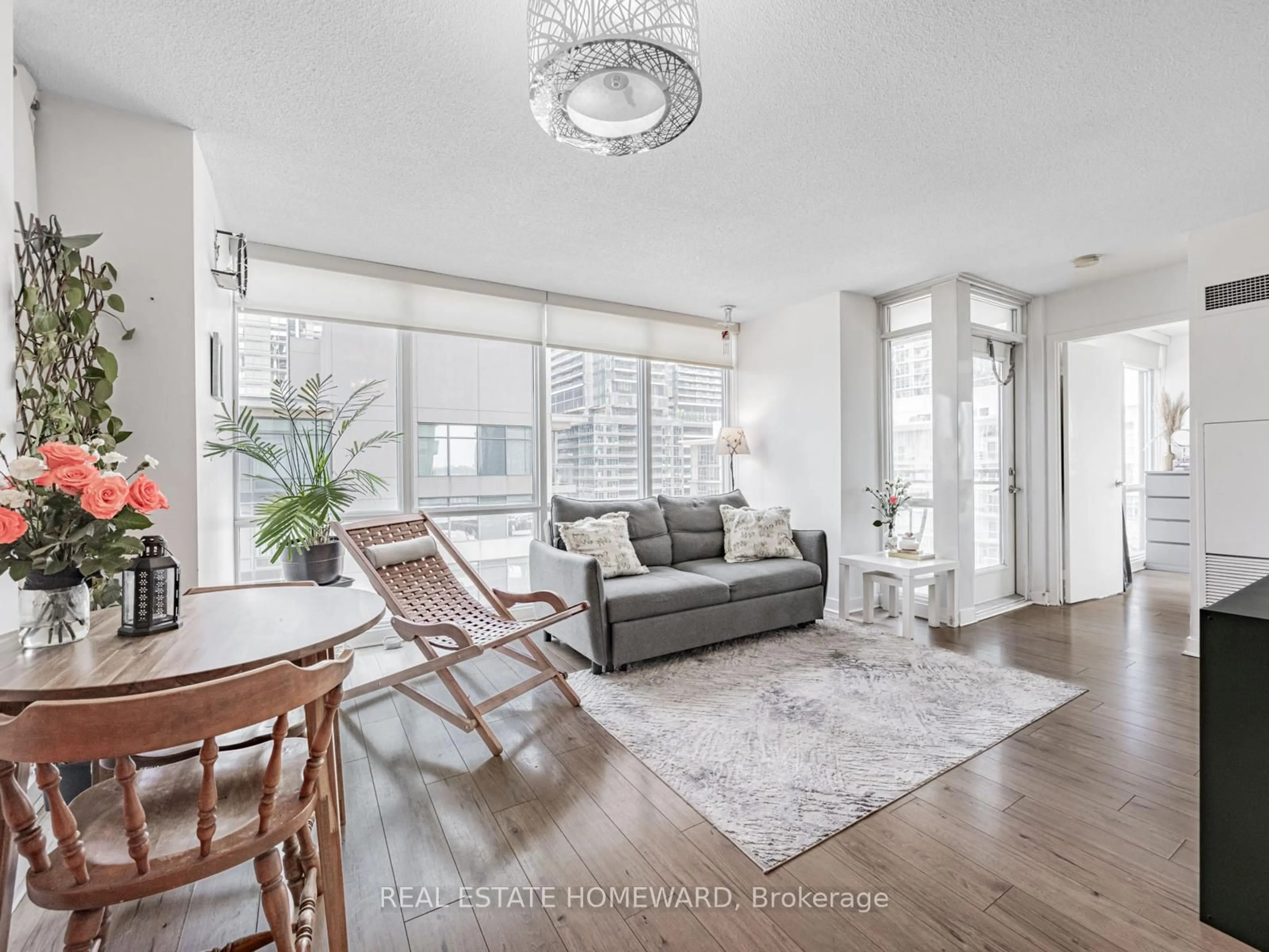 Living room with furniture, wood/laminate floor for 11 Brunel Crt #906, Toronto Ontario M5V 3Y3