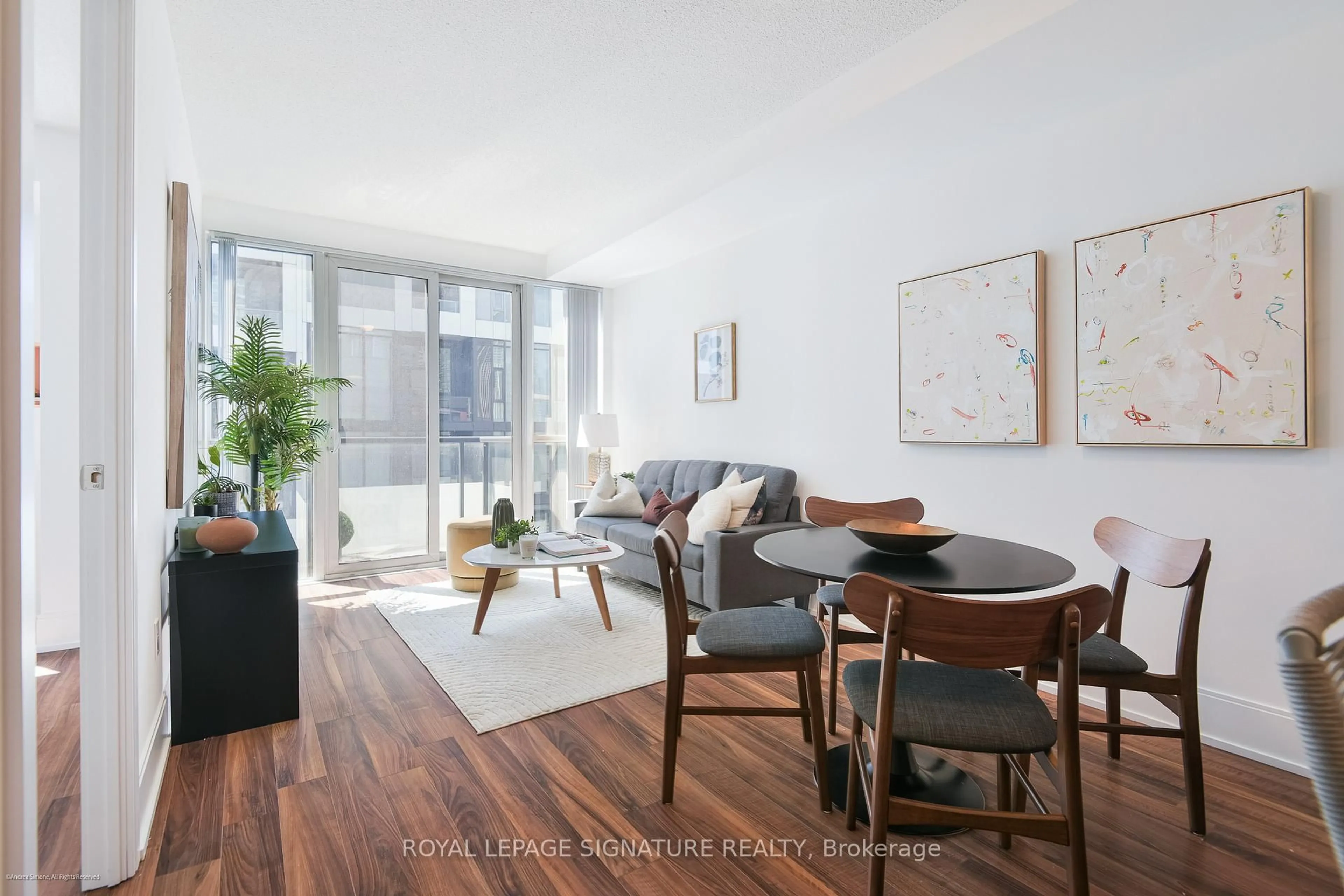 Living room with furniture, wood/laminate floor for 560 Front St #1007, Toronto Ontario M5V 1C1