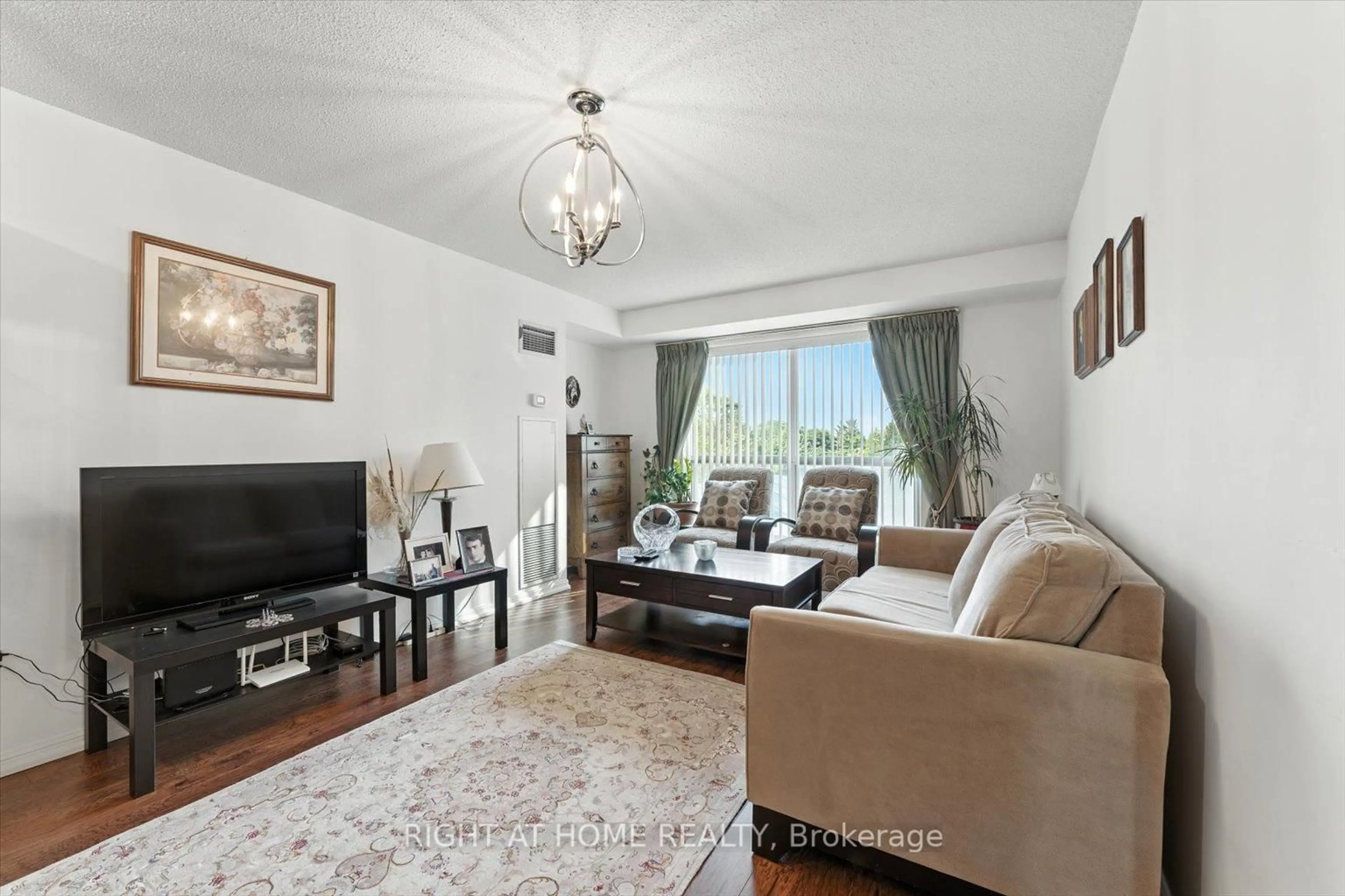 Living room with furniture, unknown for 23 Lorraine Dr #308, Toronto Ontario M2N 6Z6