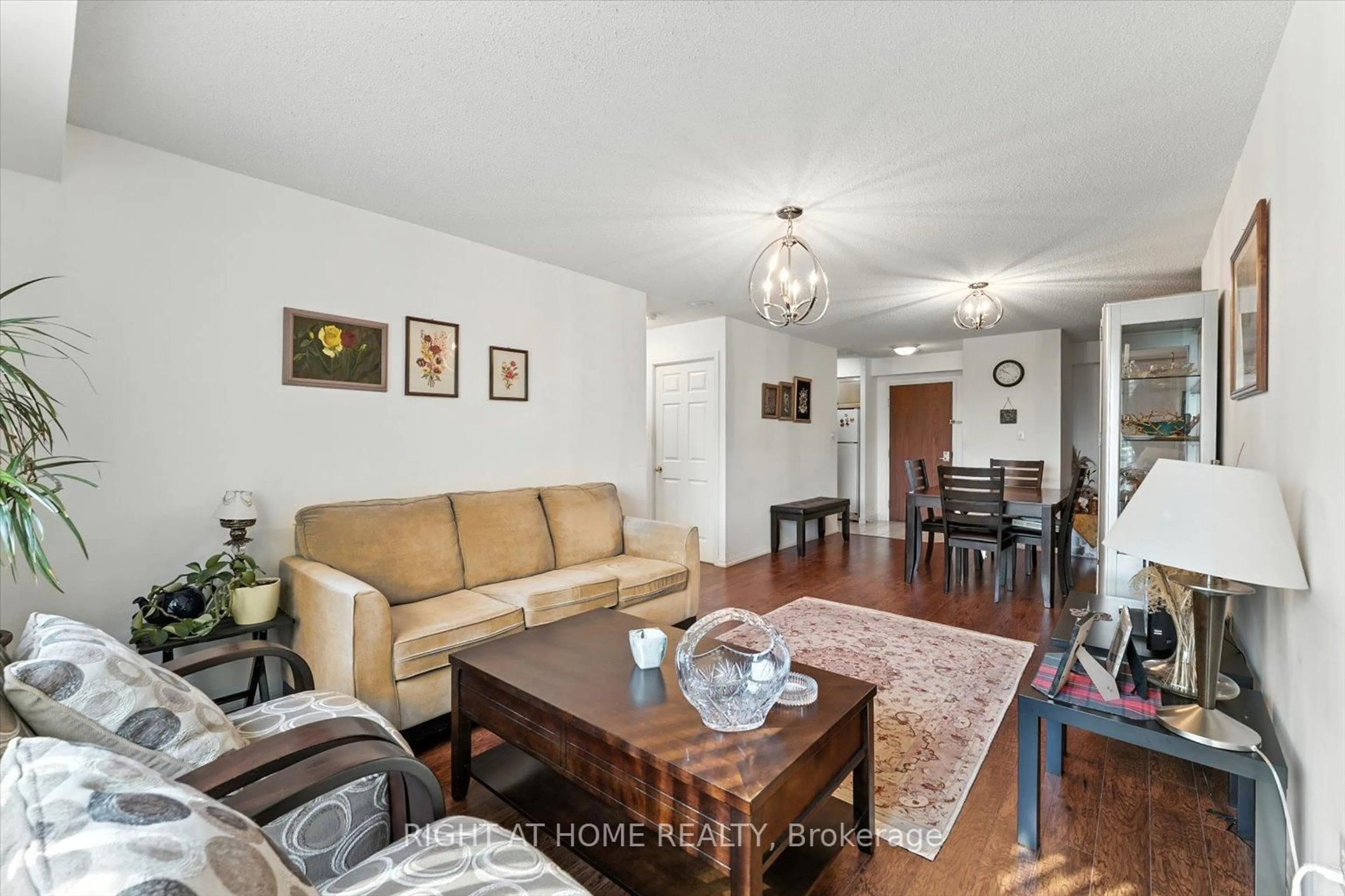 Living room with furniture, wood/laminate floor for 23 Lorraine Dr #308, Toronto Ontario M2N 6Z6