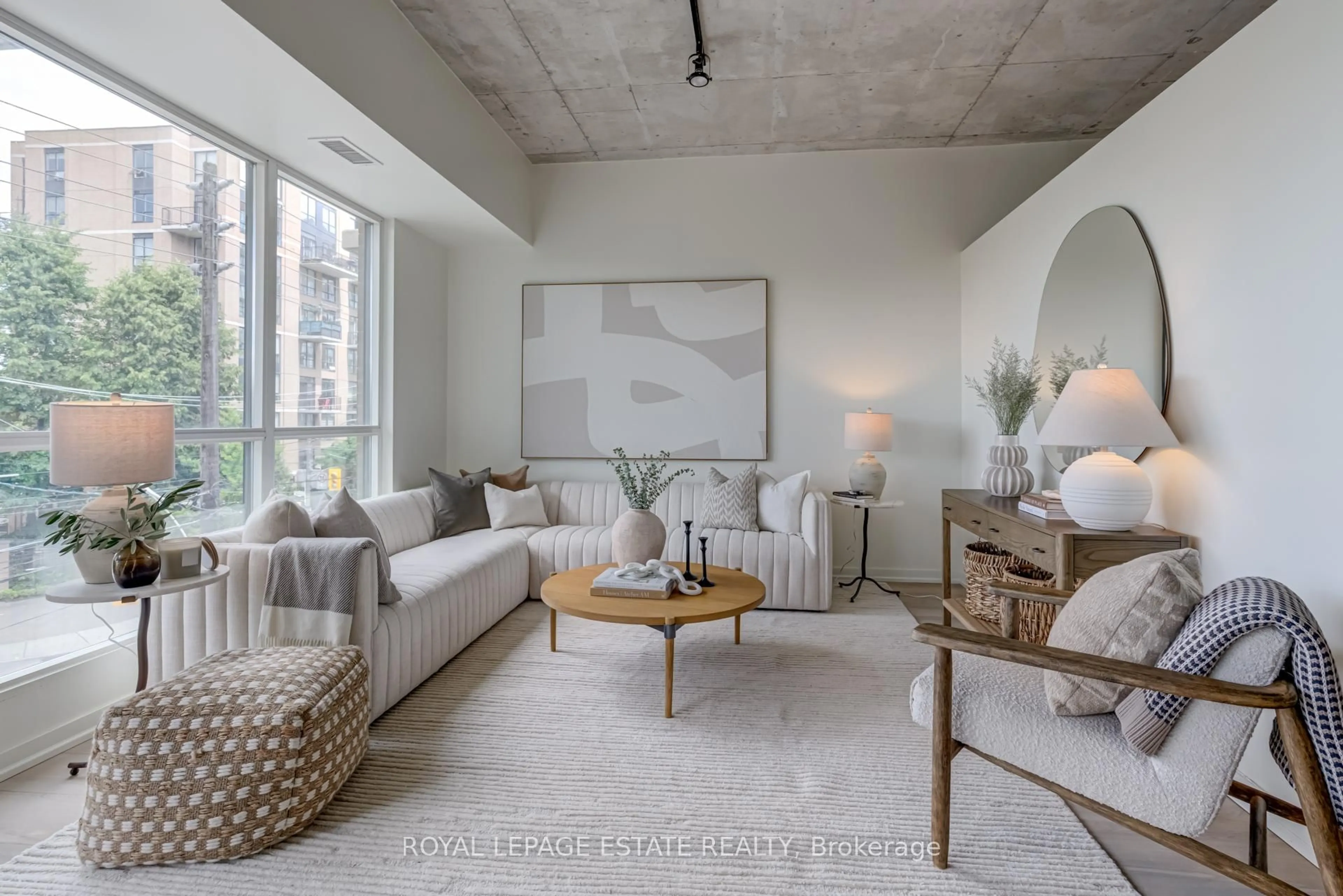 Living room with furniture, cement floor for 833 King St #311, Toronto Ontario M5V 1N9