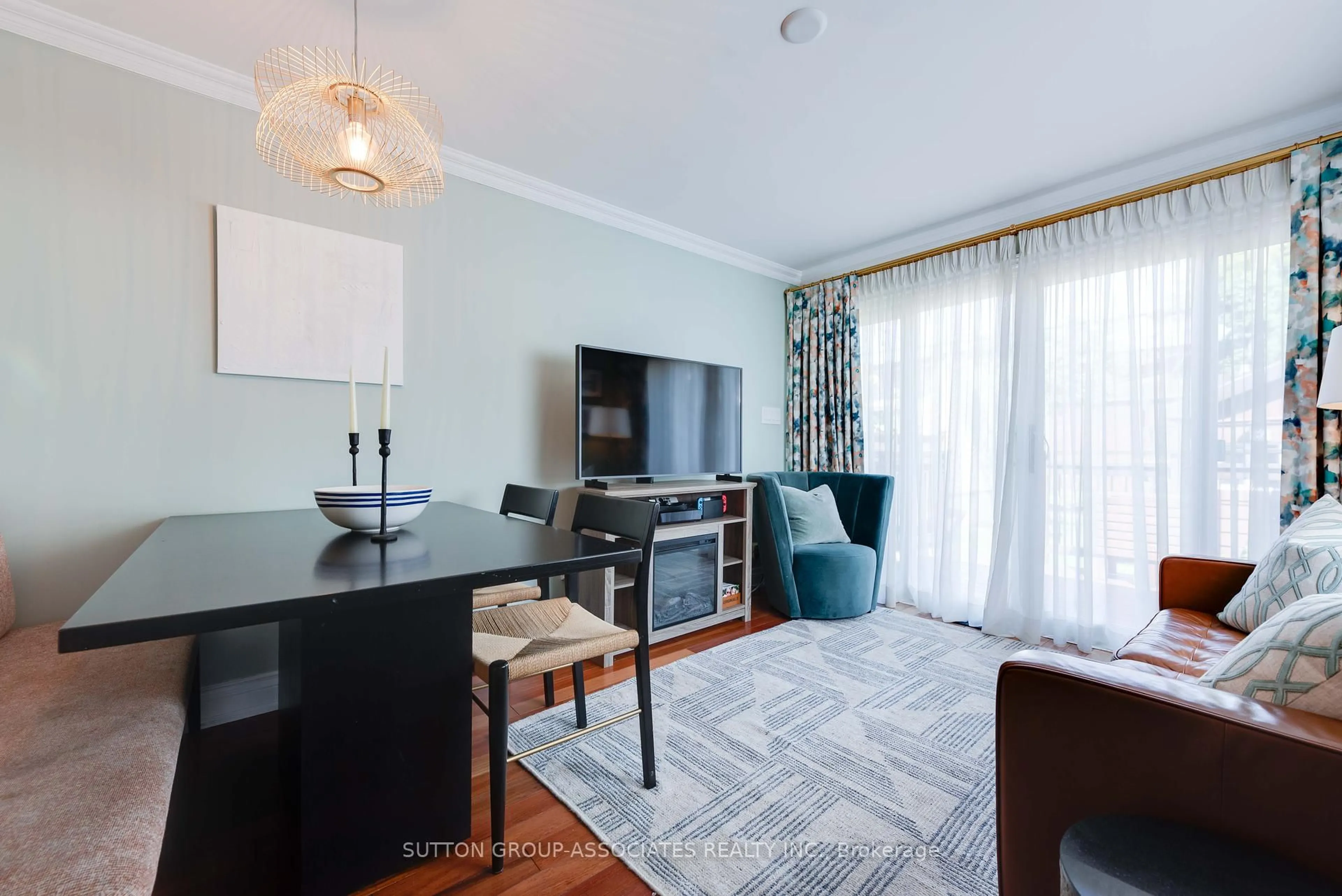 Living room with furniture, wood/laminate floor for 275 Robina Ave, Toronto Ontario M6C 3Y9