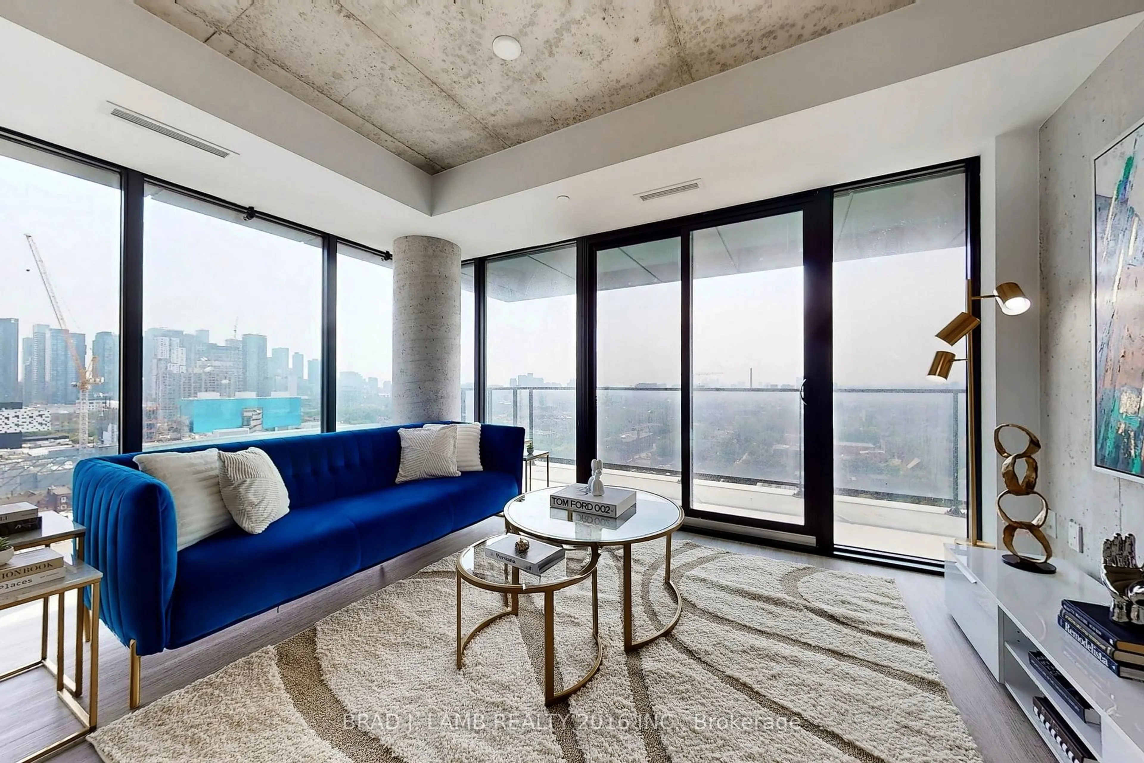 Living room with furniture, cement floor for 195 McCaul St #1511, Toronto Ontario M5T 0E5
