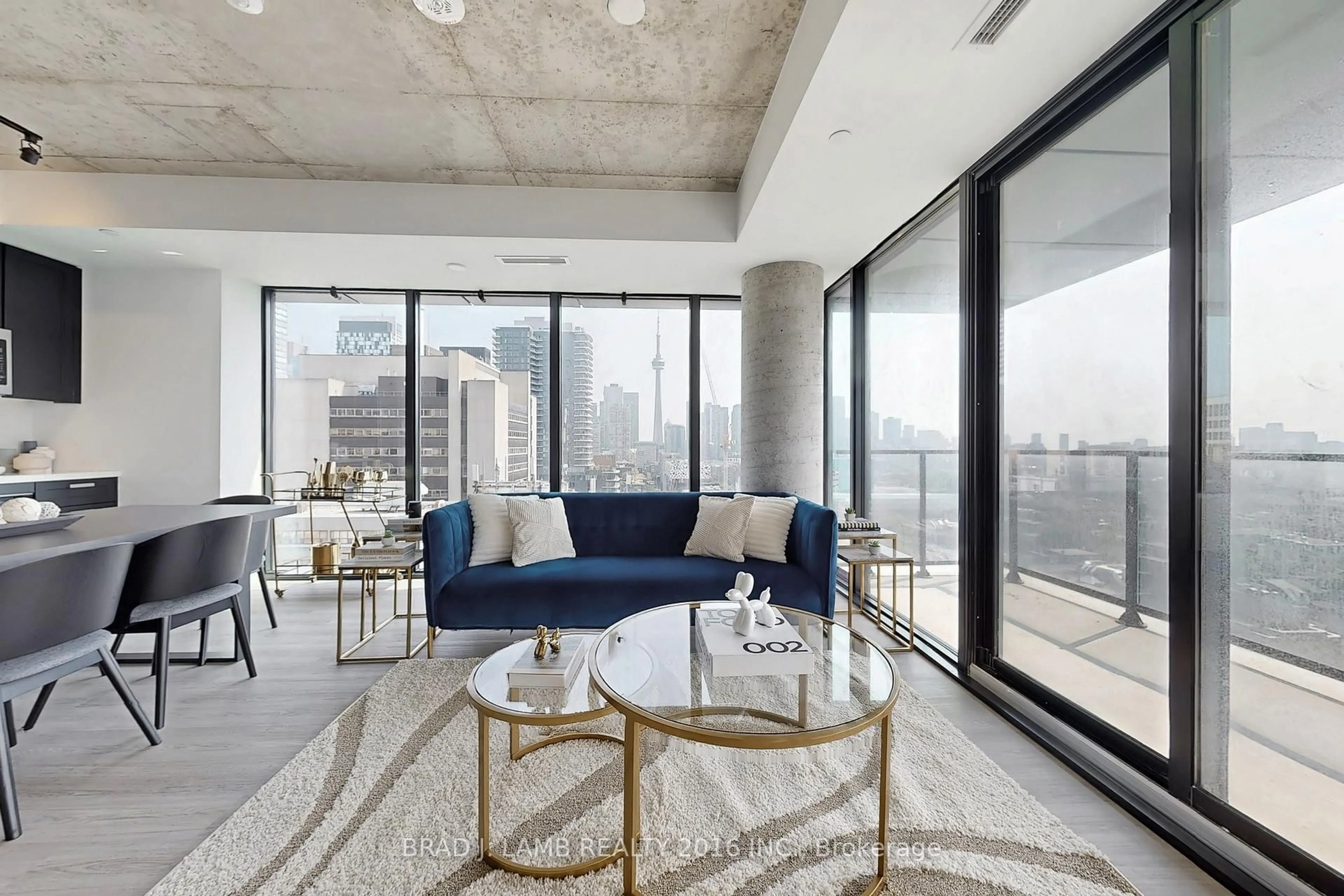 Living room with furniture, cement floor for 195 McCaul St #1511, Toronto Ontario M5T 0E5