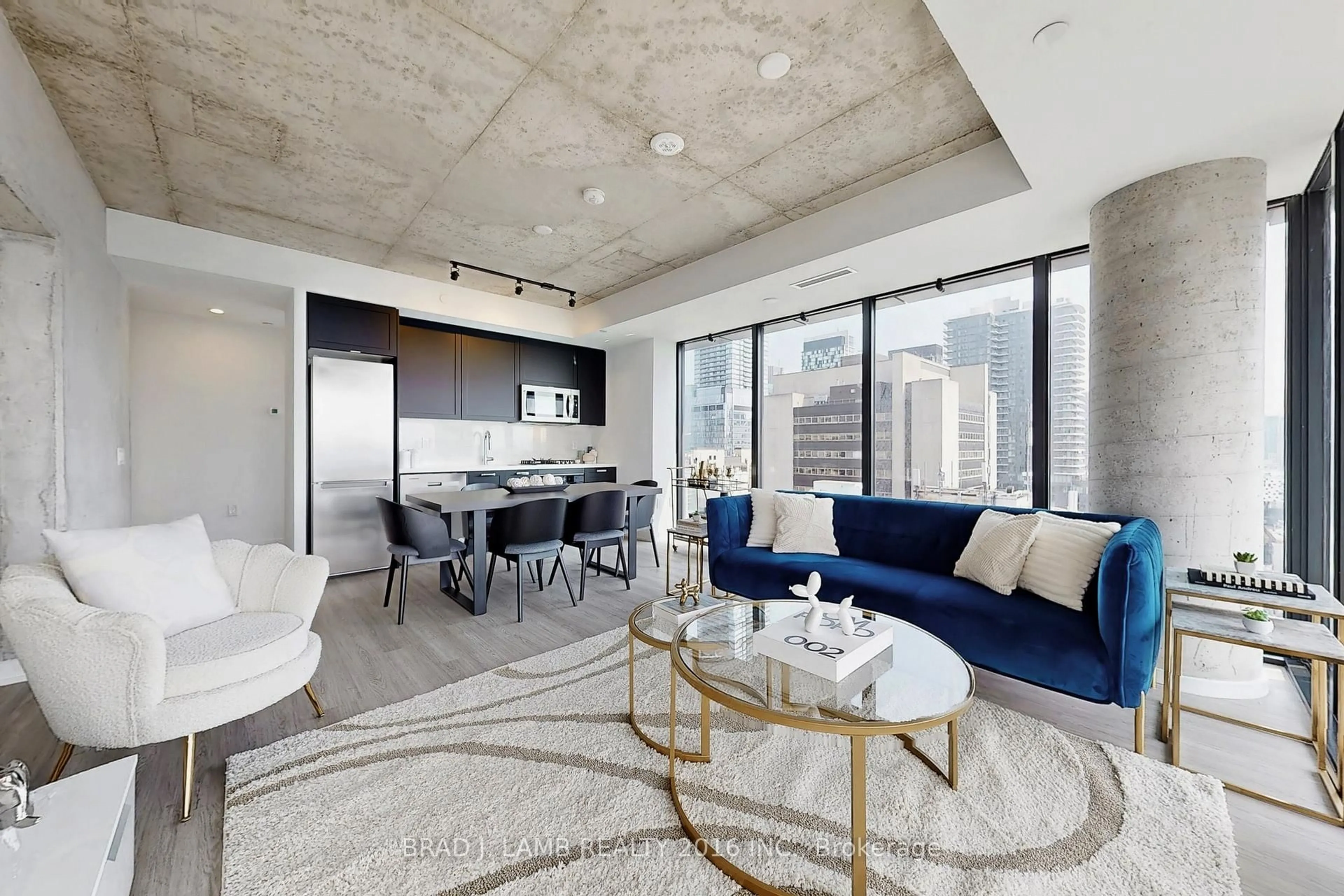 Living room with furniture, cement floor for 195 McCaul St #1511, Toronto Ontario M5T 0E5