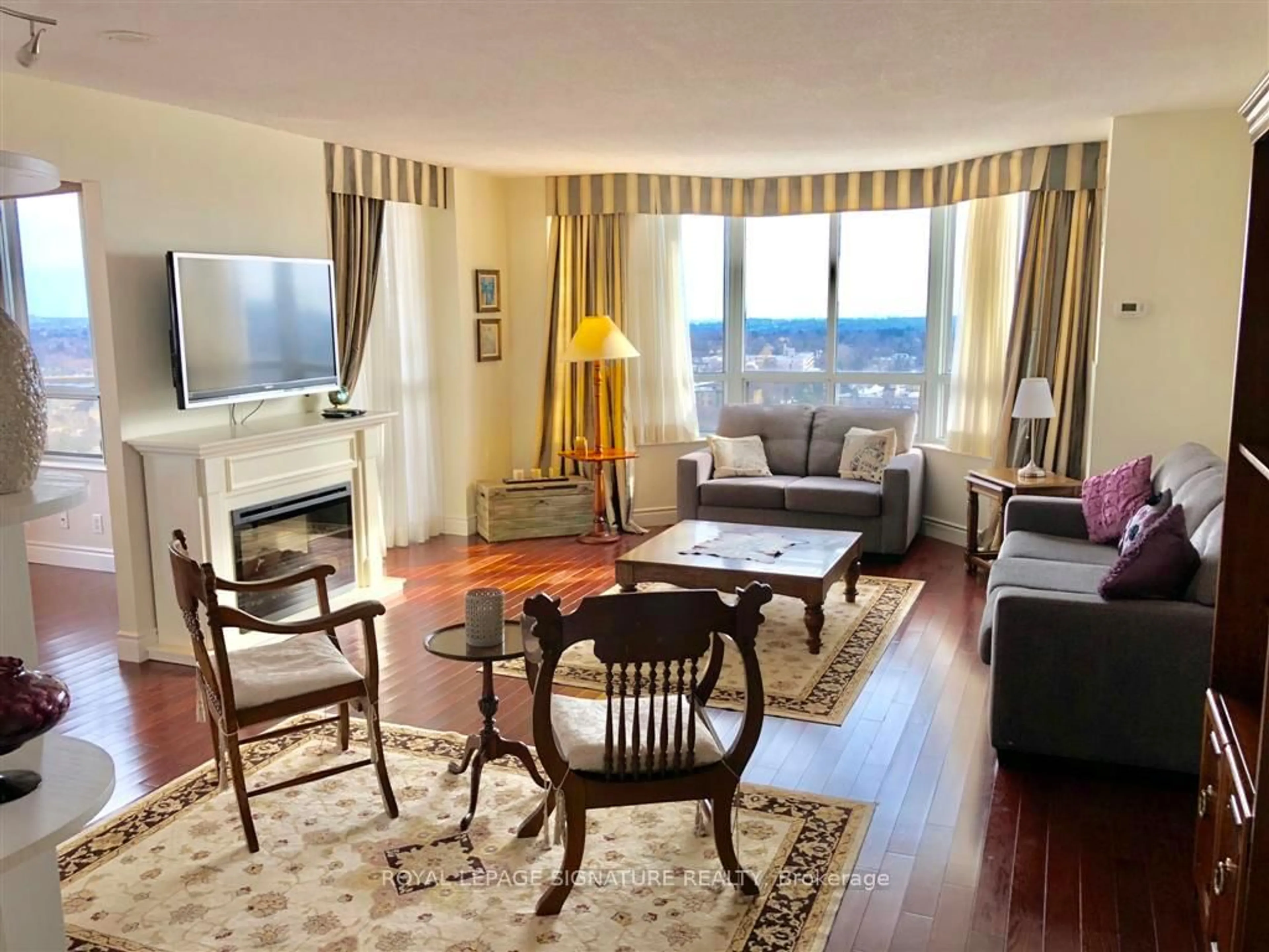 Living room with furniture, wood/laminate floor for 78 Harrison Garden Blvd #1507, Toronto Ontario M2N 7E2