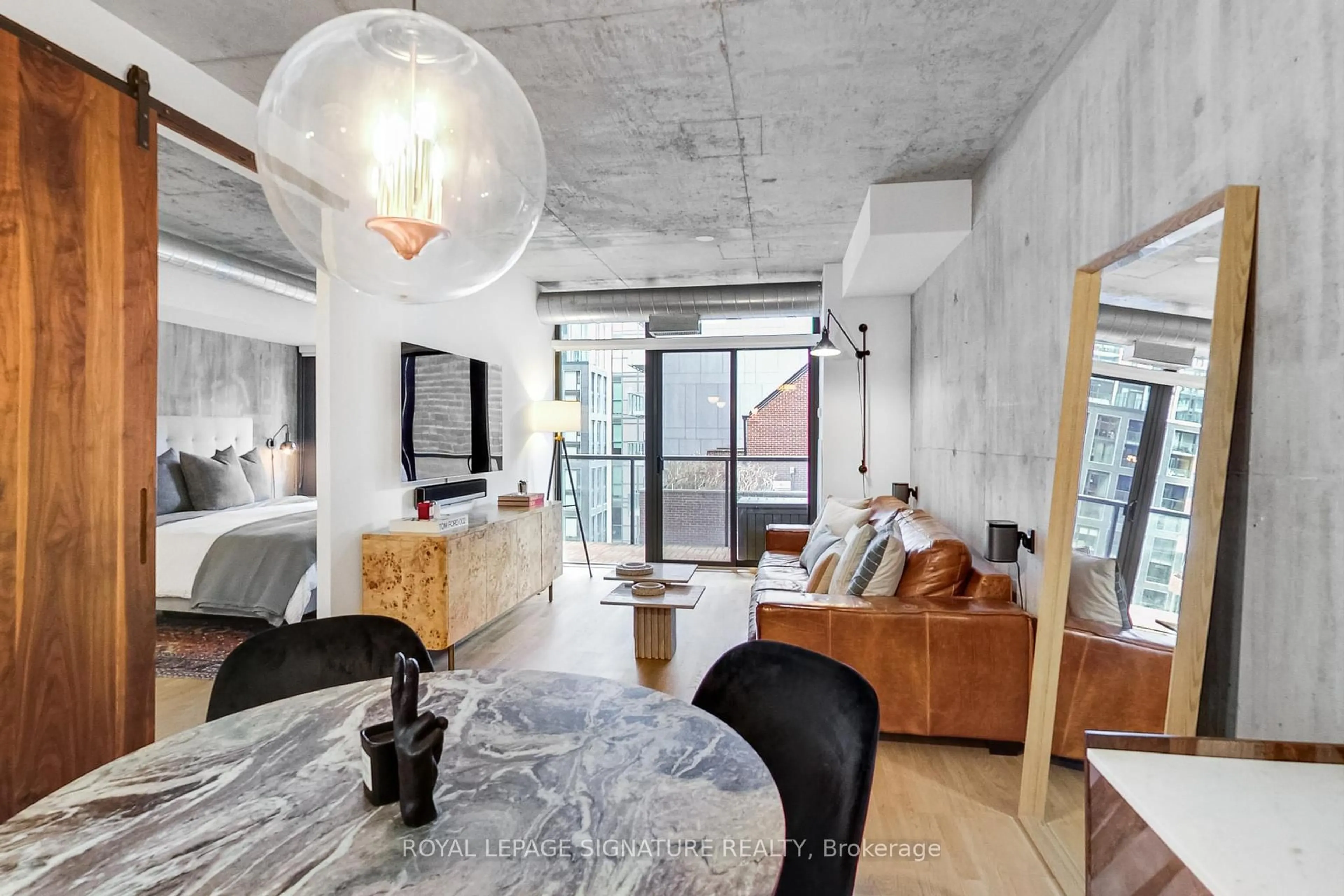 Living room with furniture, cement floor for 138 Princess St #614, Toronto Ontario M5A 0B1