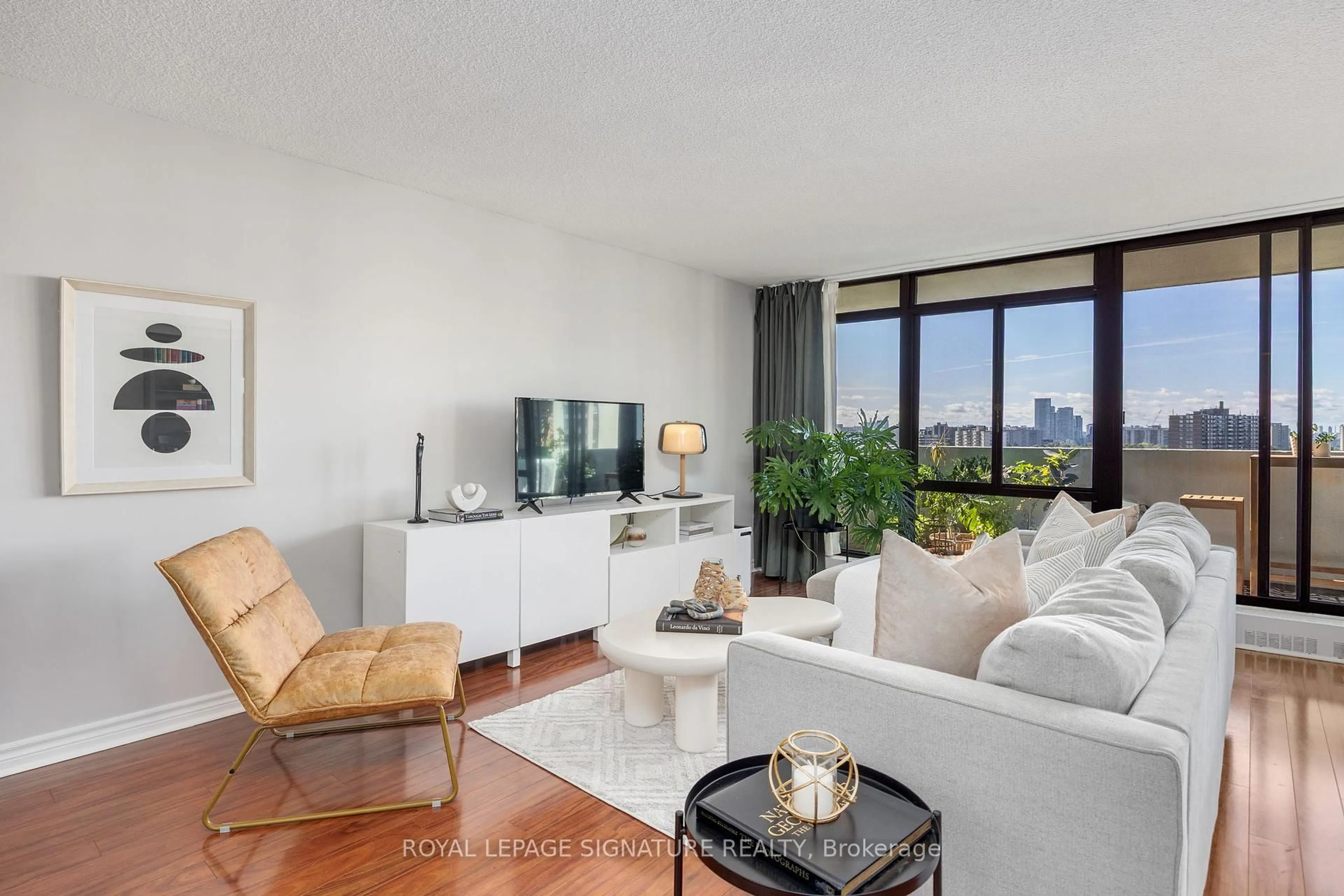 Living room with furniture, unknown for 3300 Don Mills Rd #1107, Toronto Ontario M2J 4X7