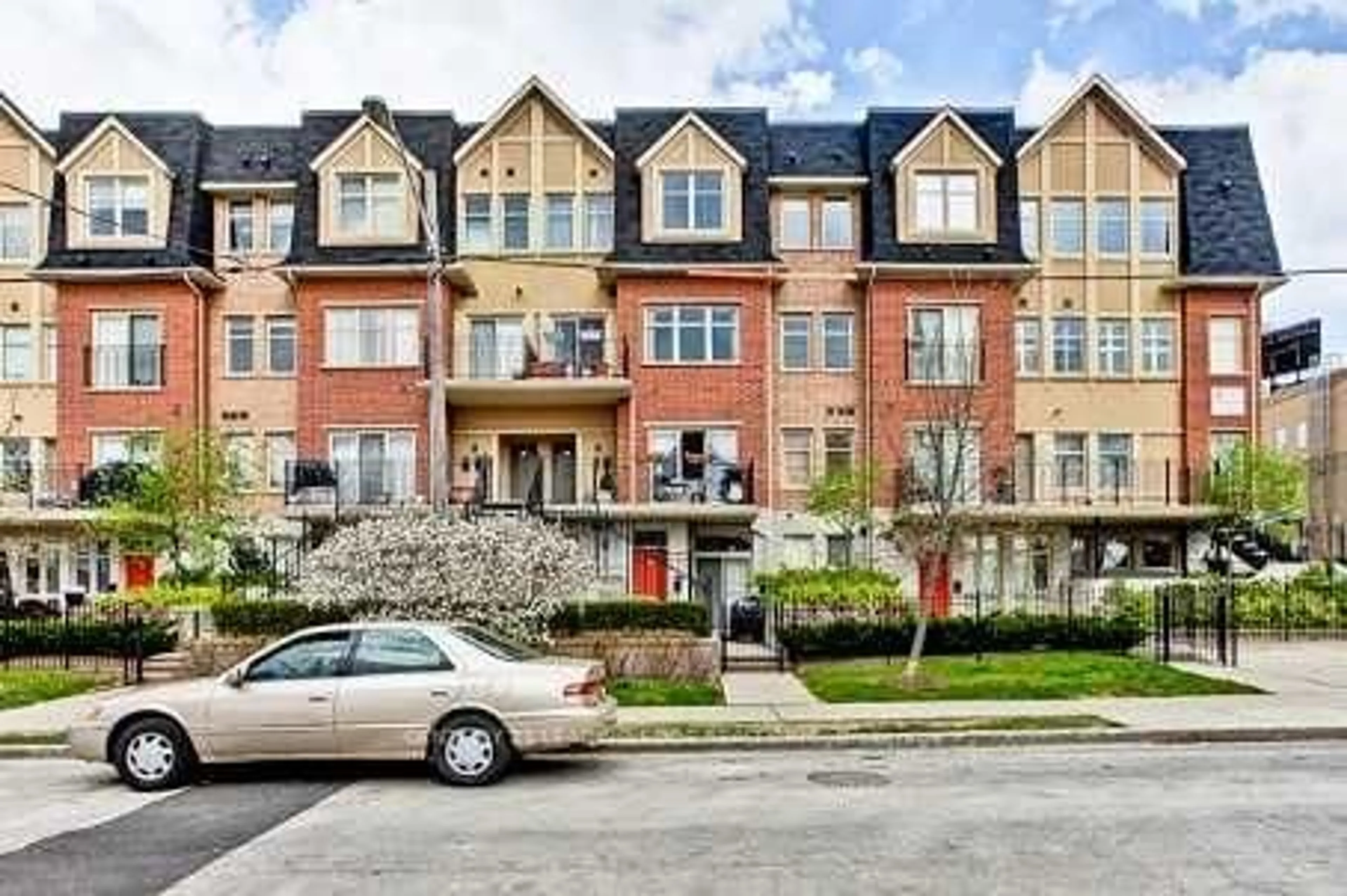 Home with brick exterior material, street for 65 Cranborne Ave #202, Toronto Ontario M4A 2Y5
