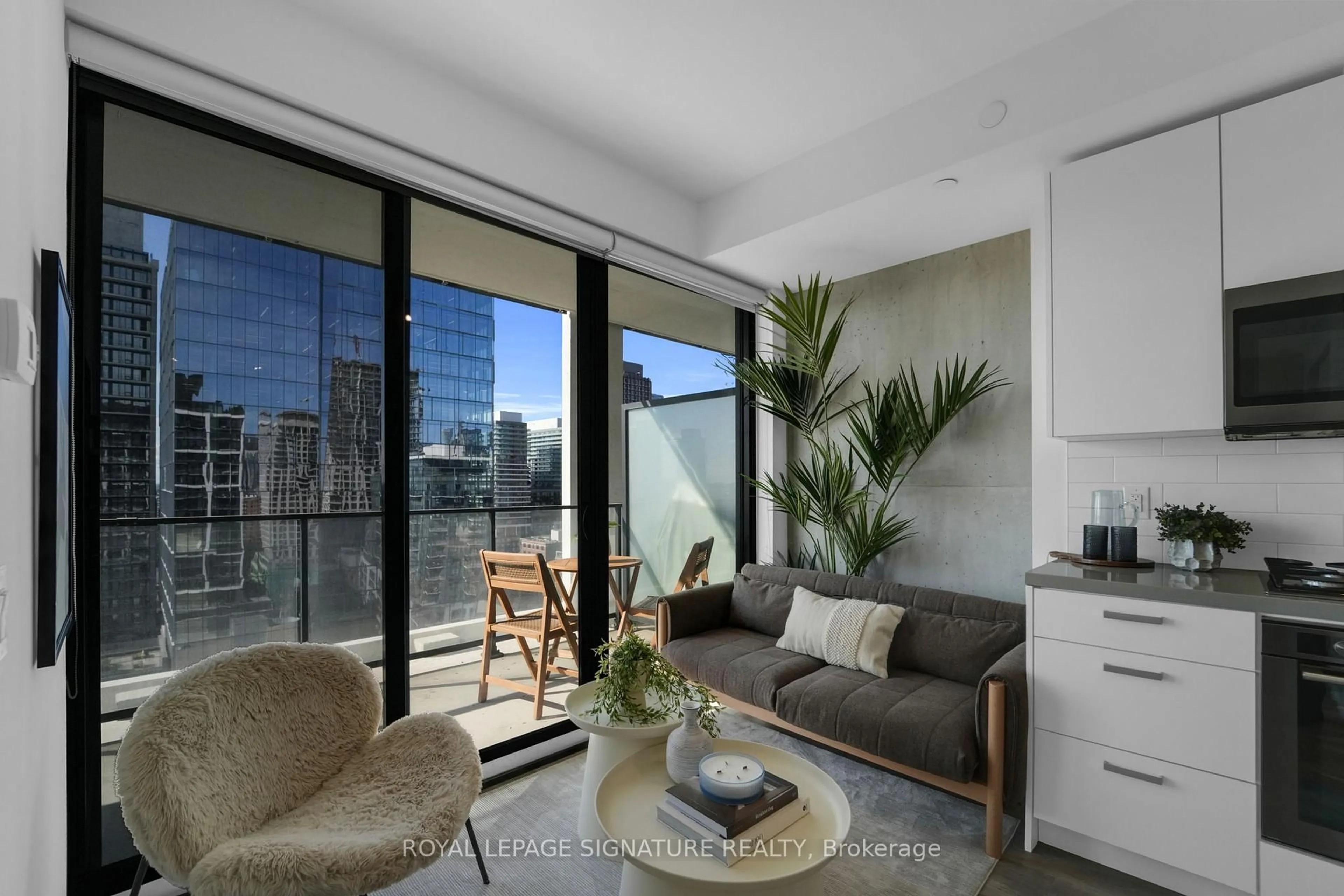 Living room with furniture, cement floor for 55 Ontario St #1906, Toronto Ontario M5A 0T8
