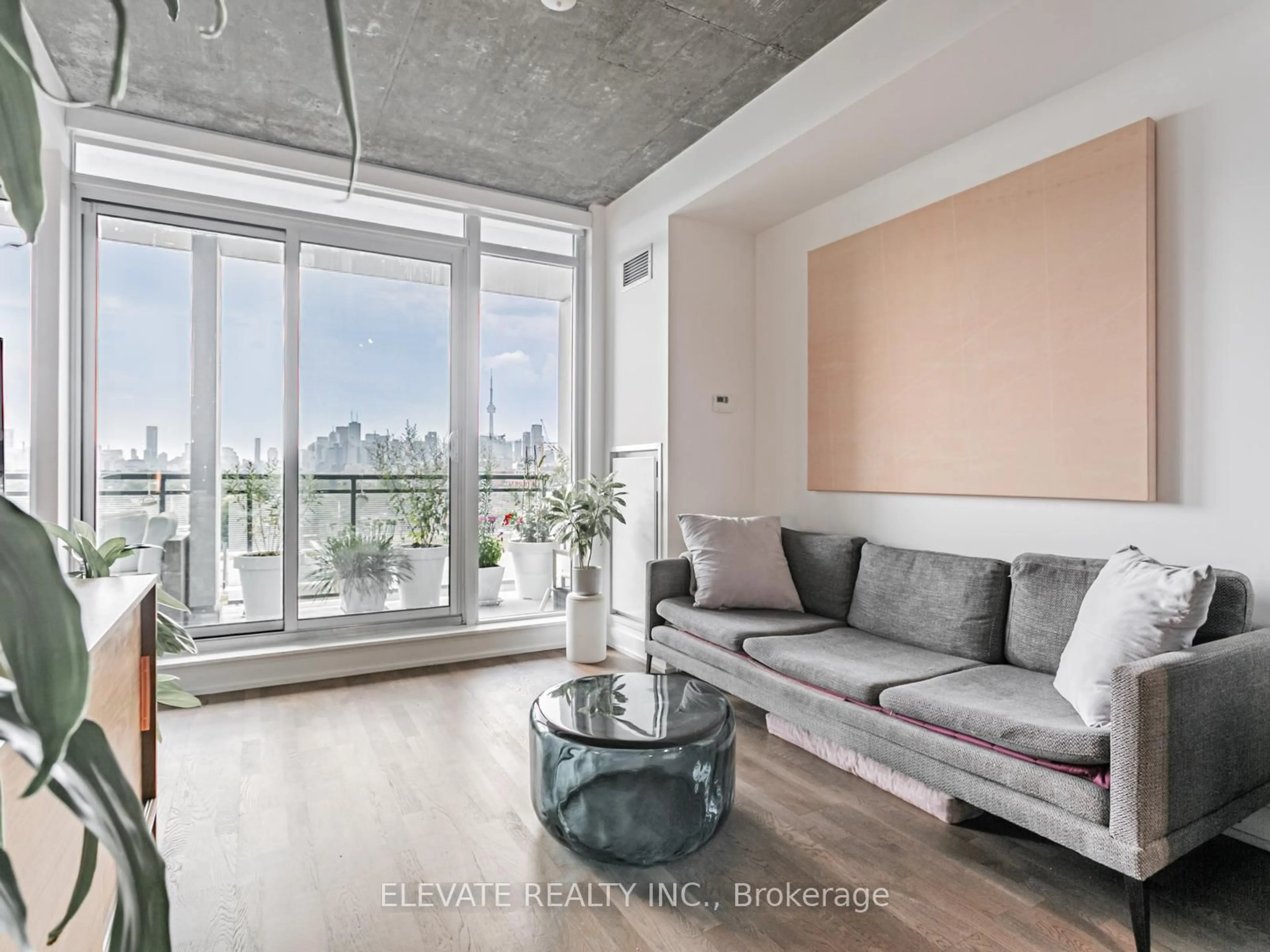 Living room with furniture, cement floor for 20 Minowan Miikan Lane #924, Toronto Ontario M6J 0E5
