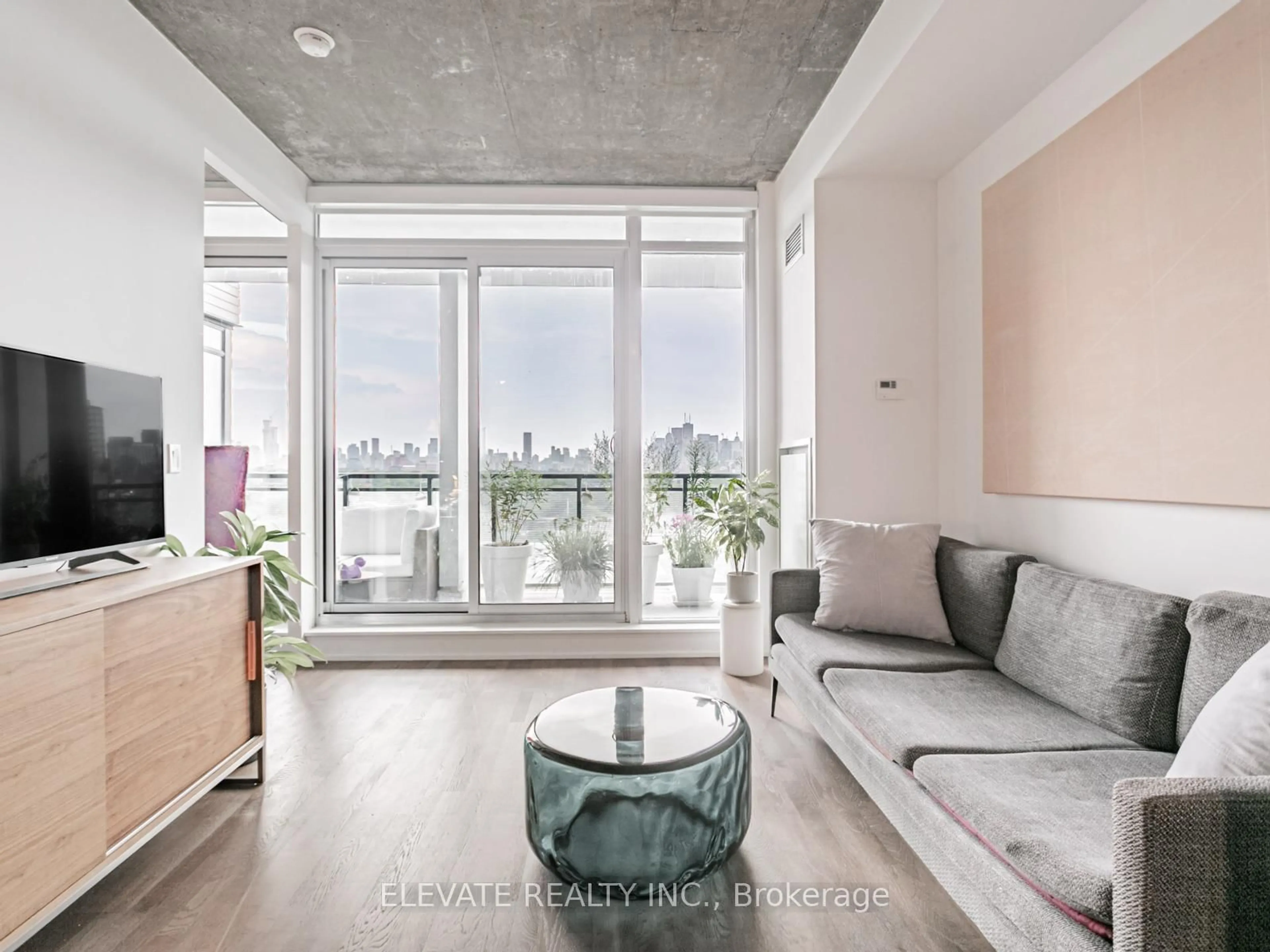 Living room with furniture, cement floor for 20 Minowan Miikan Lane #924, Toronto Ontario M6J 0E5