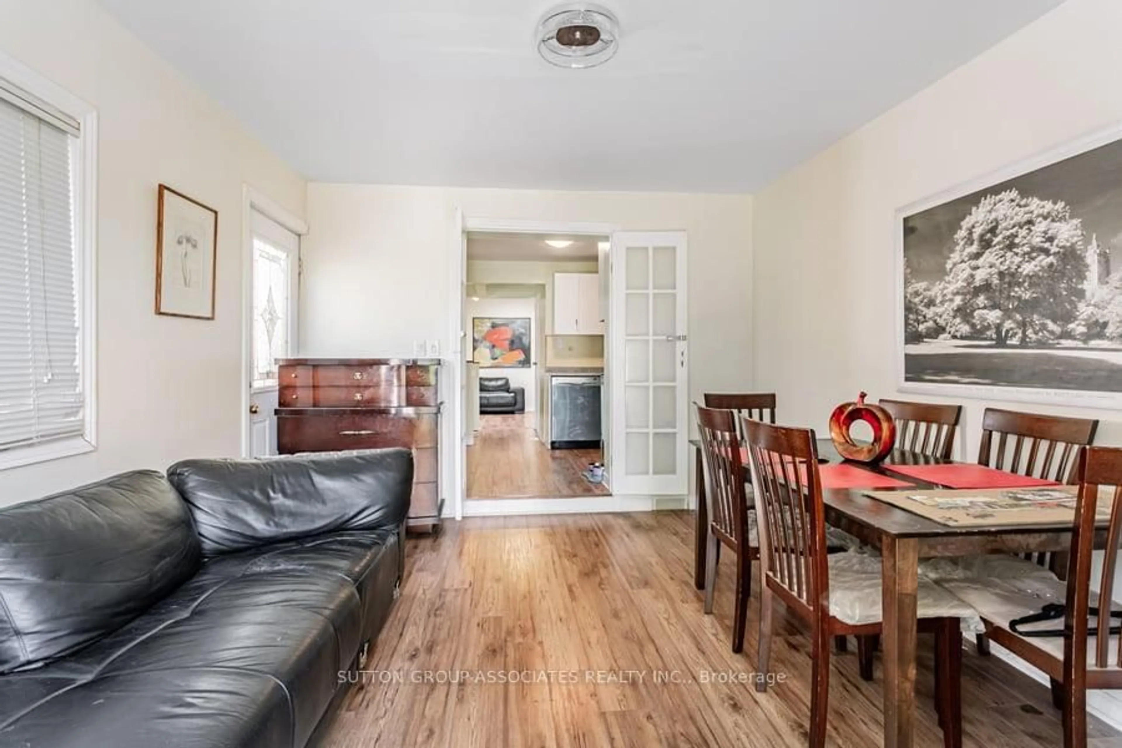 Living room with furniture, wood/laminate floor for 534 A Westmount Ave, Toronto Ontario M6E 3N7