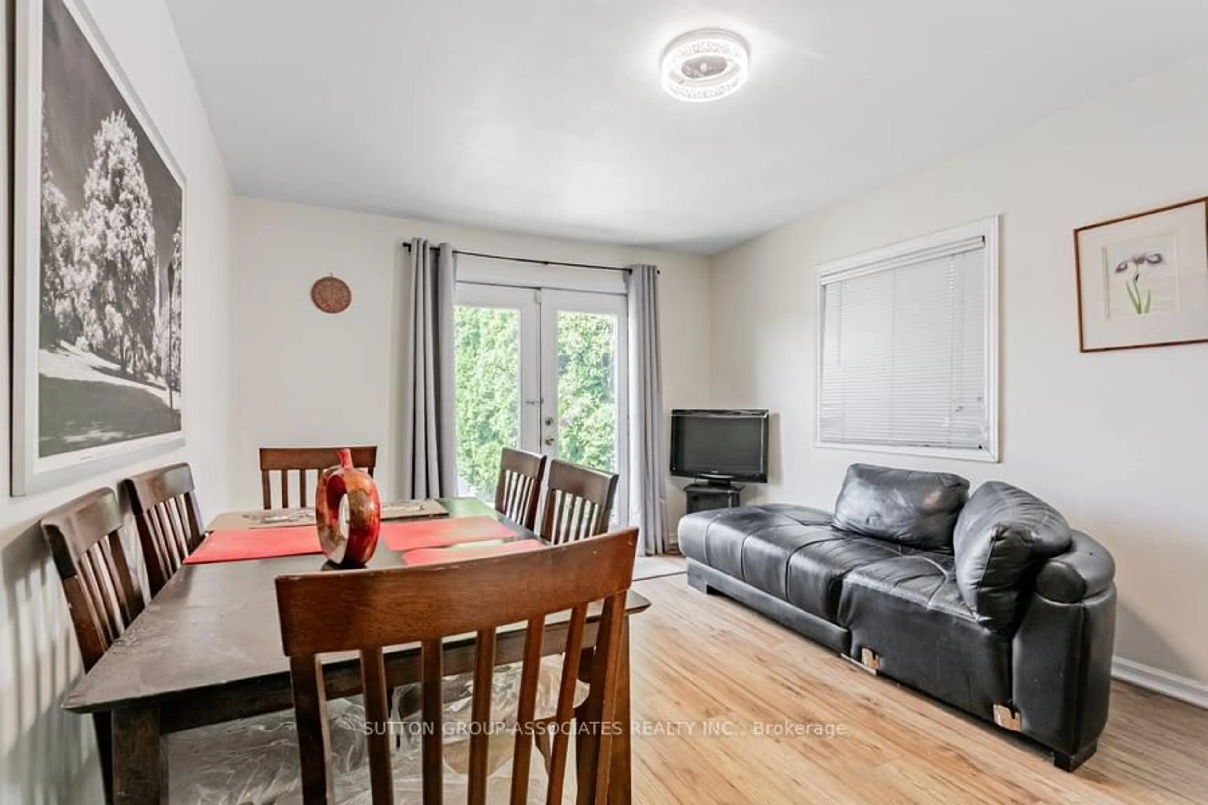 Living room with furniture, wood/laminate floor for 534 A Westmount Ave, Toronto Ontario M6E 3N7