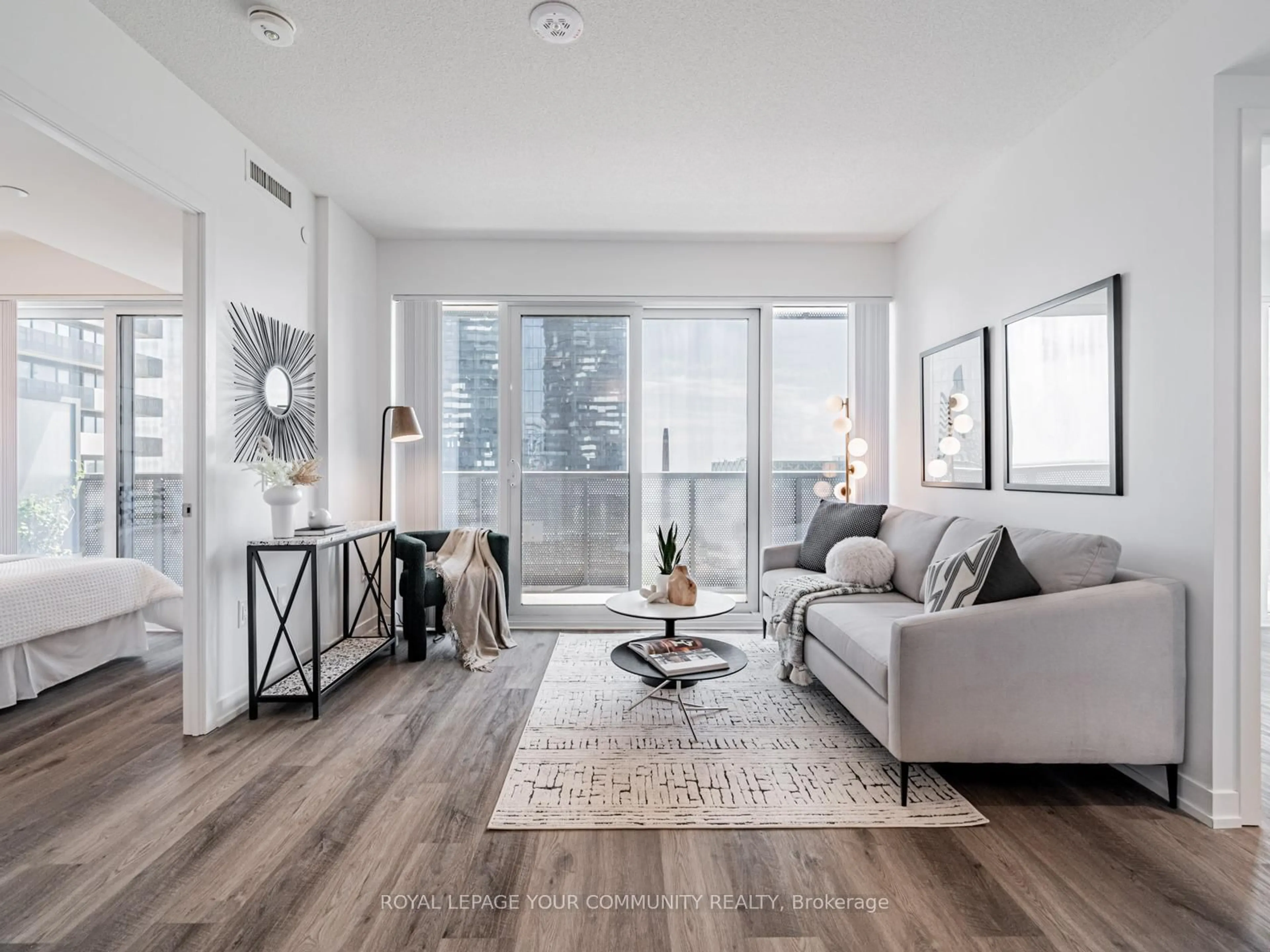 Living room with furniture, wood/laminate floor for 55 Cooper St #1611, Toronto Ontario M5E 0G1