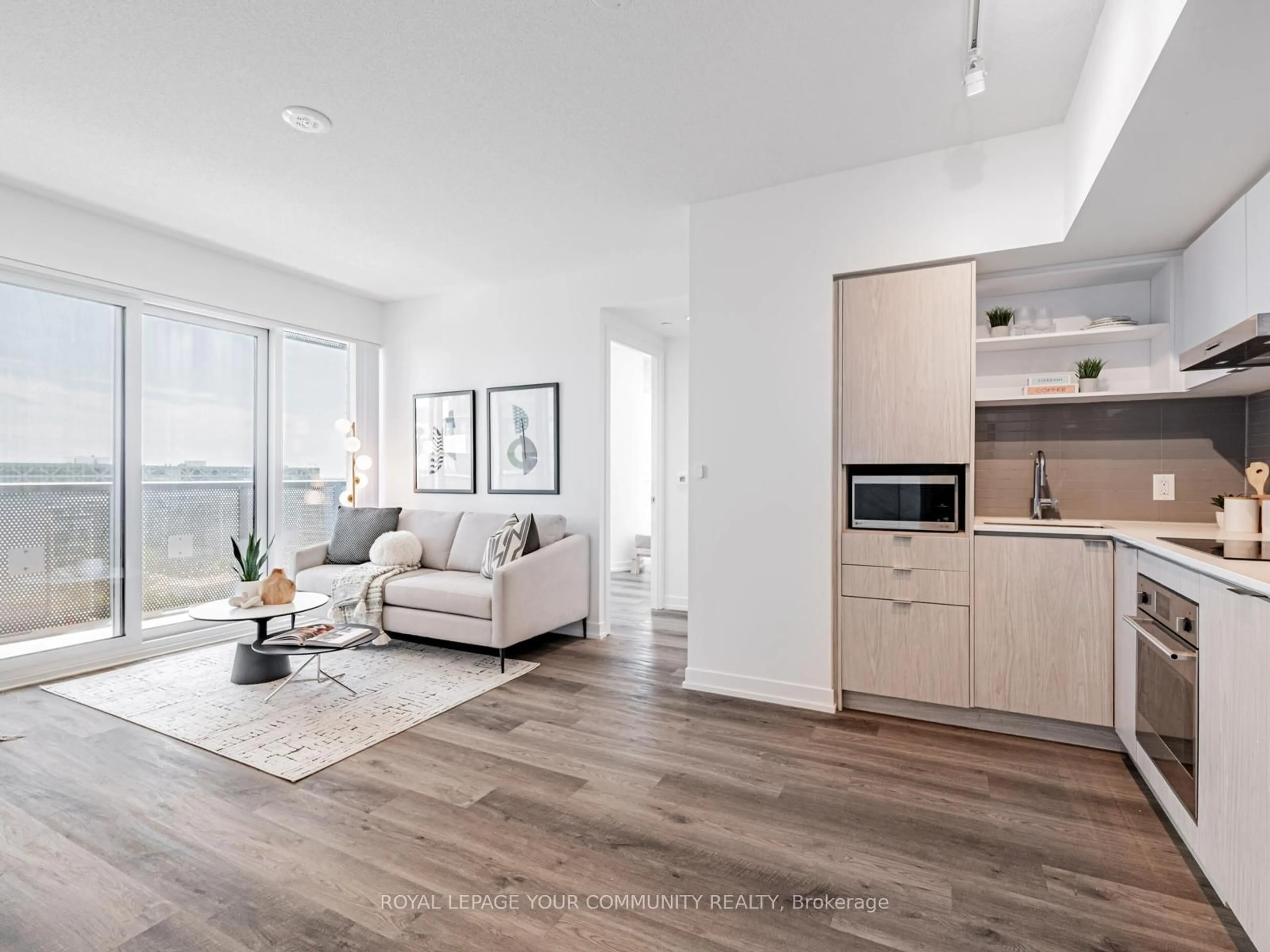 Living room with furniture, wood/laminate floor for 55 Cooper St #1611, Toronto Ontario M5E 0G1