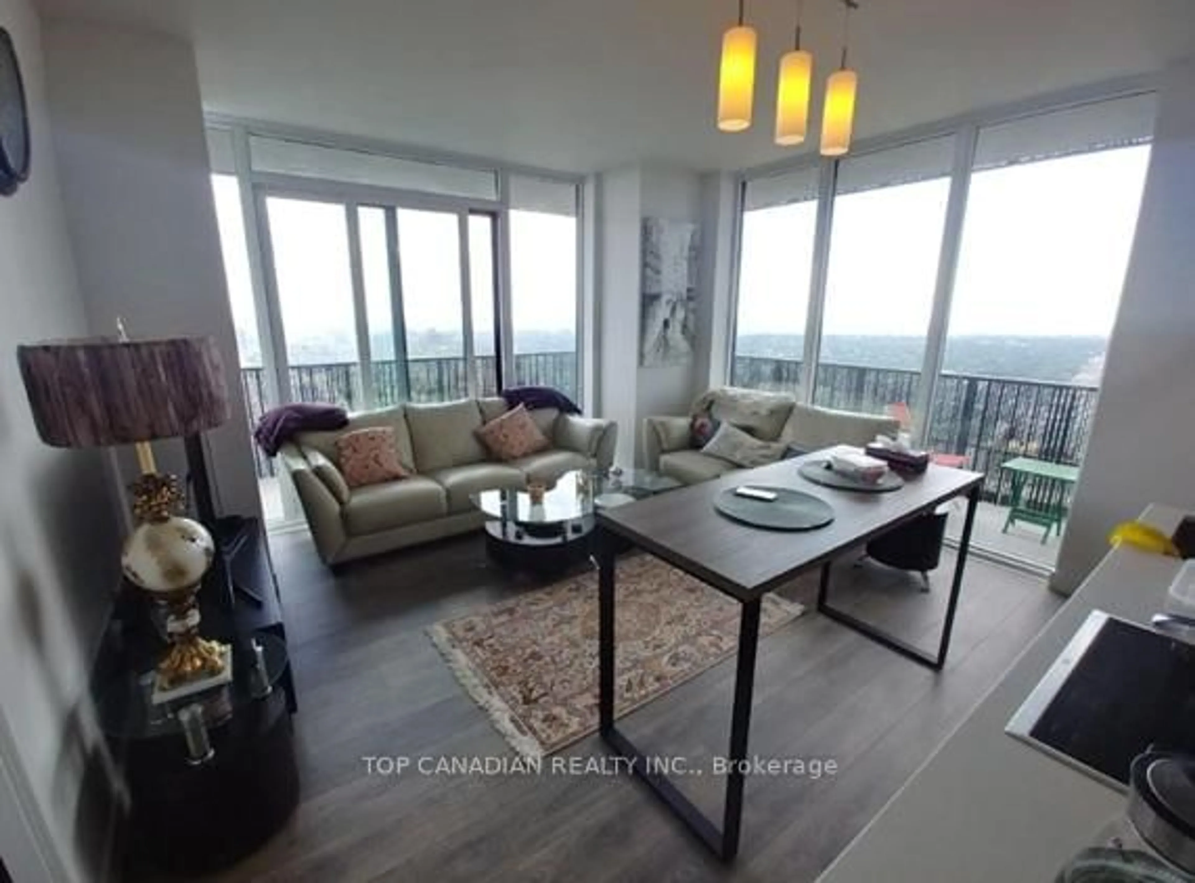 Living room with furniture, wood/laminate floor for 8 Eglinton Ave #3302, Toronto Ontario M4P 0C1