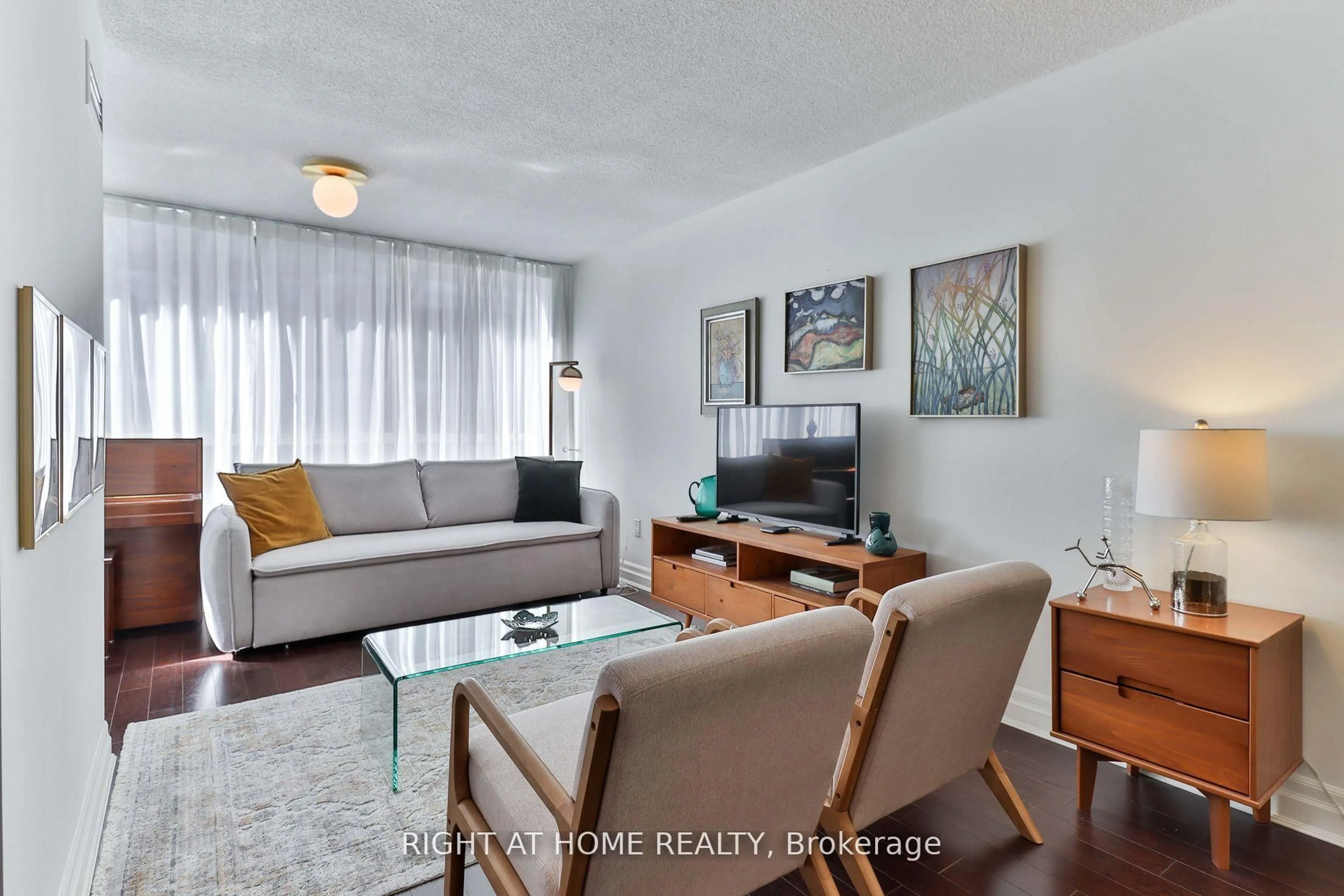 Living room with furniture, wood/laminate floor for 225 Davenport Rd #402, Toronto Ontario M5R 3R2