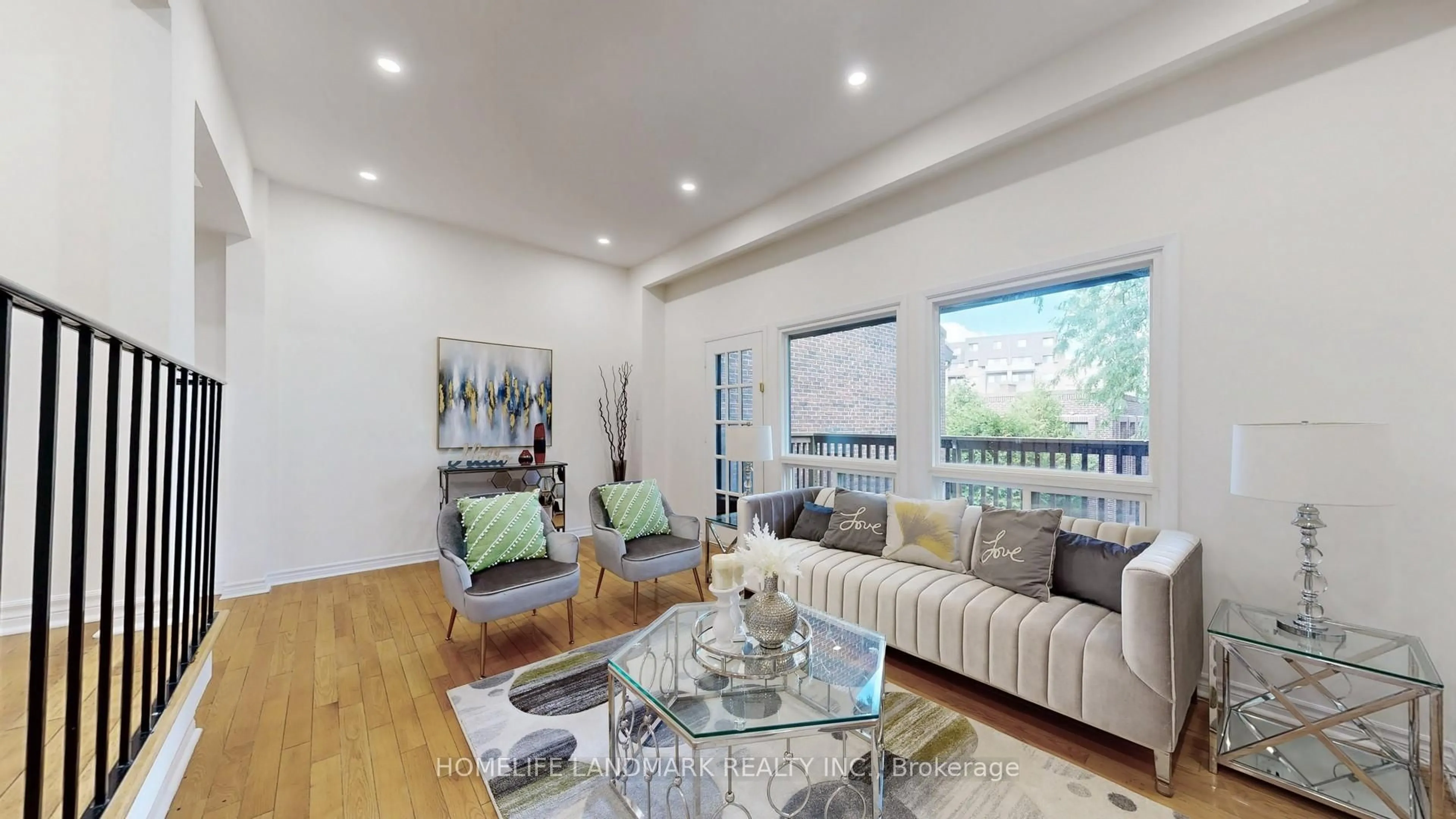 Living room with furniture, wood/laminate floor for 100 Spire Hill Way #4, Toronto Ontario M2H 3A6