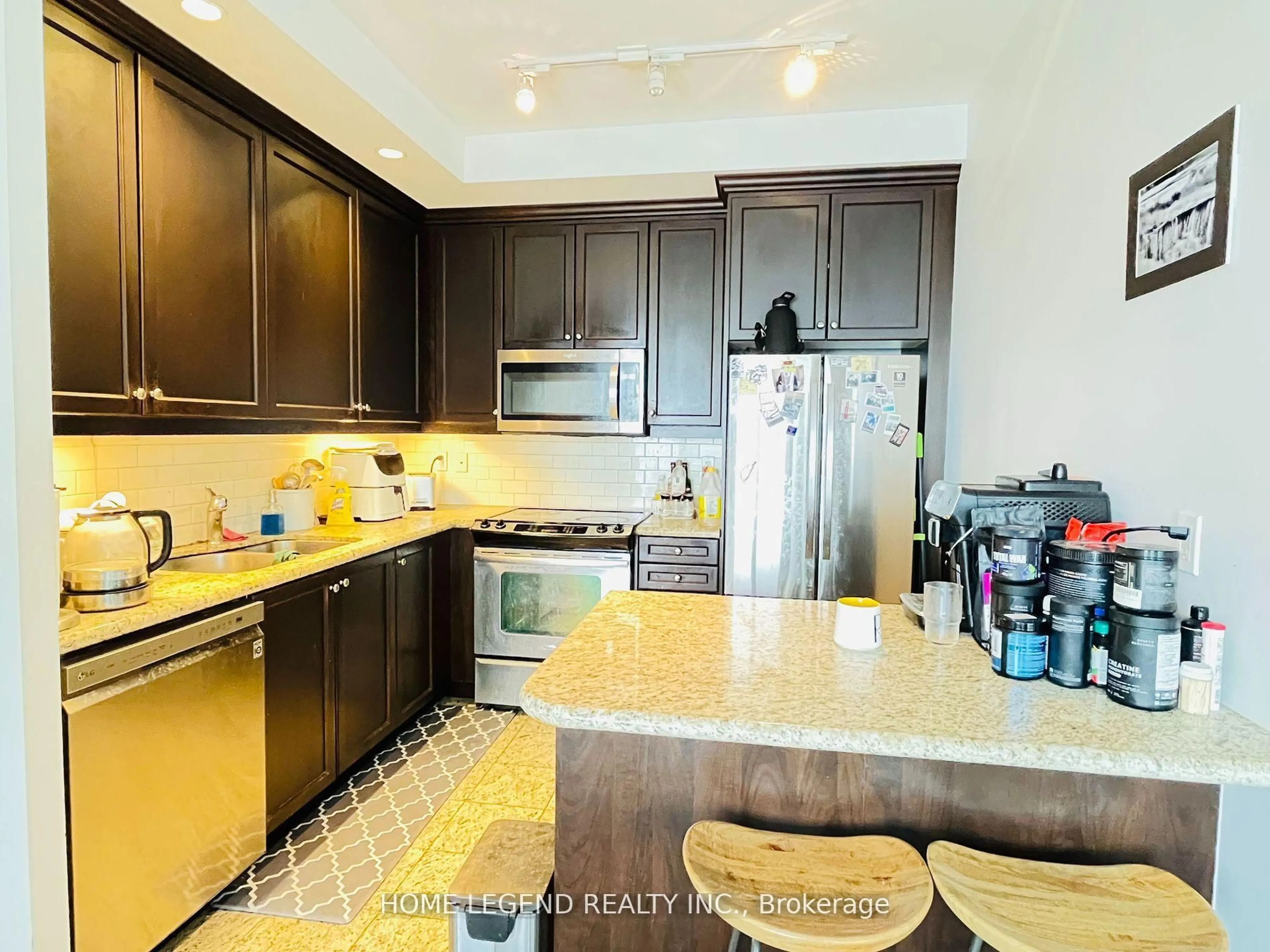 Open concept kitchen, ceramic/tile floor for 21 Grand Magazine St #1809, Toronto Ontario M5V 1B5