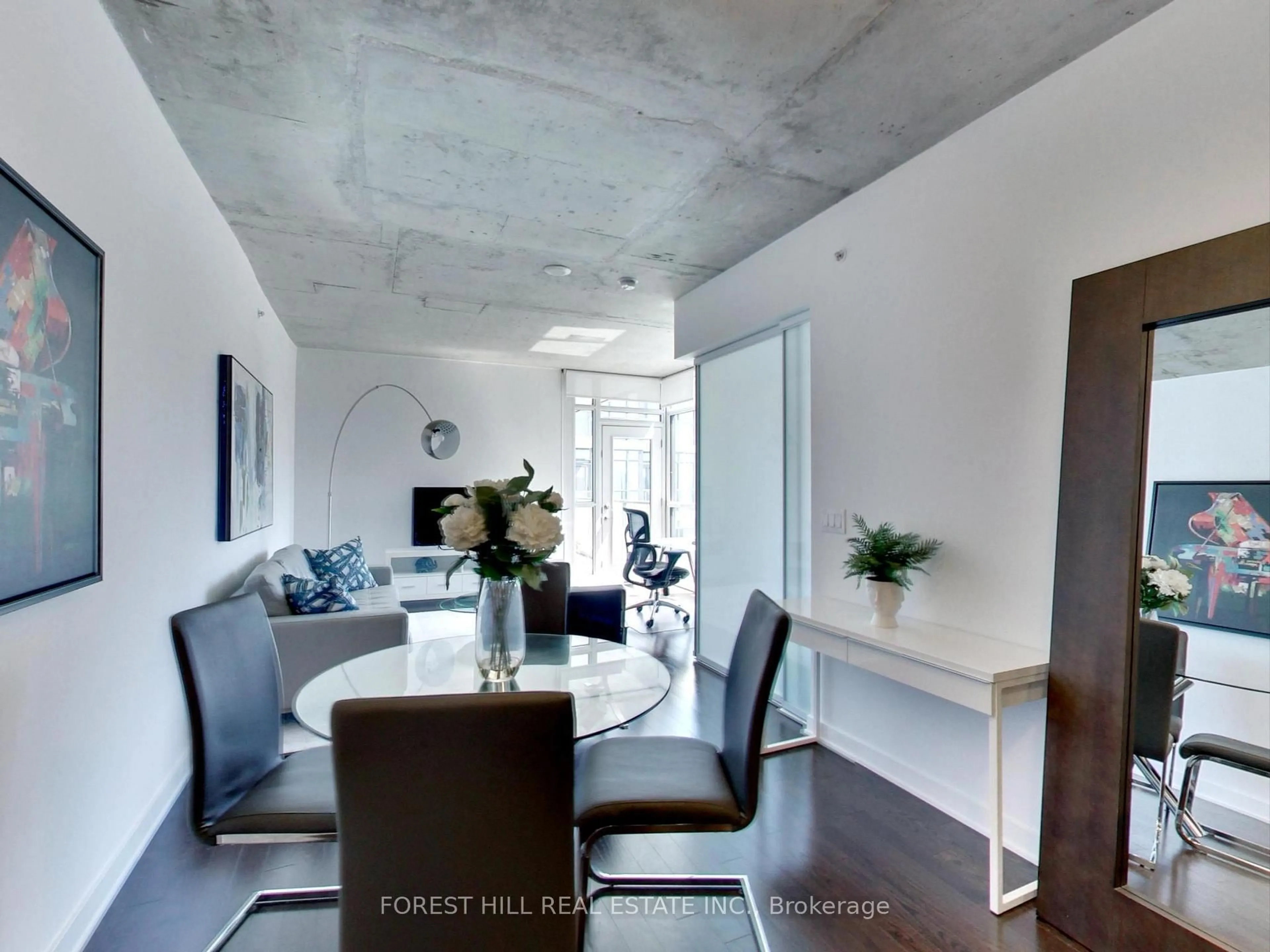 Dining room, cement floor for 210 Simcoe St #2301, Toronto Ontario M5T 0A9