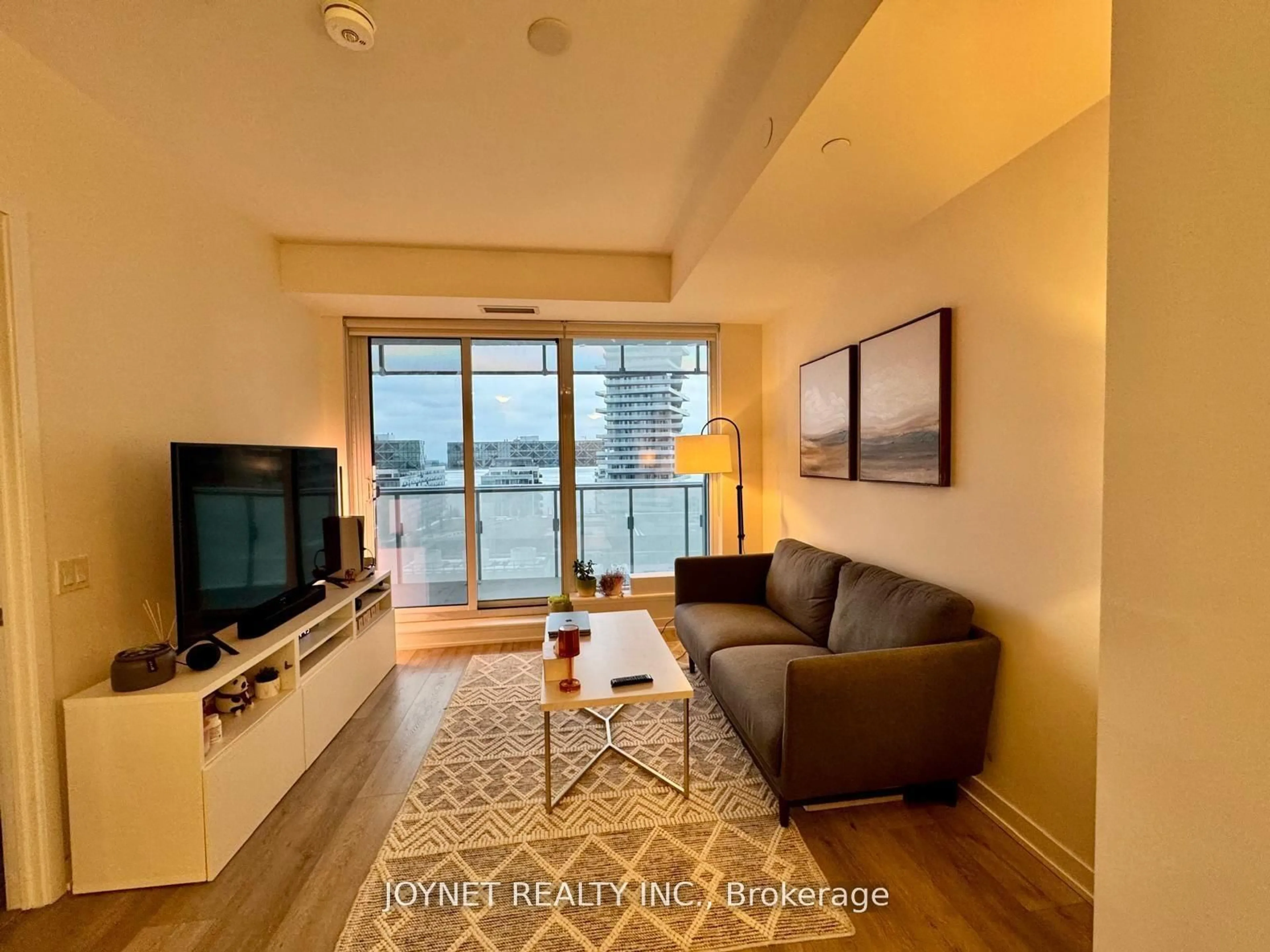 Living room with furniture, wood/laminate floor for 28 Freeland St #1201, Toronto Ontario M5E 0E3