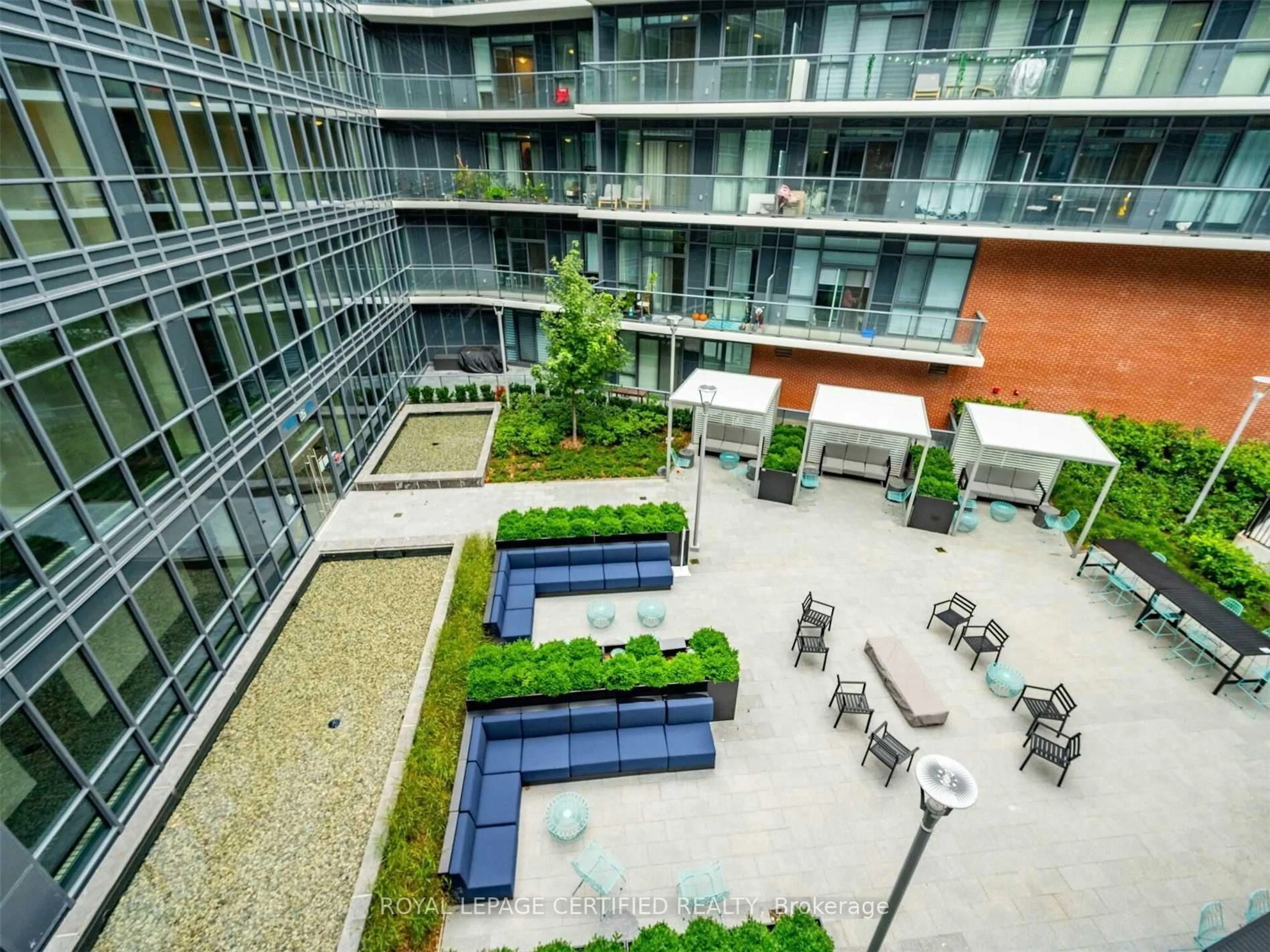 Patio, city buildings view from balcony for 38 Iannuzzi St #502, Toronto Ontario M5V 0S2